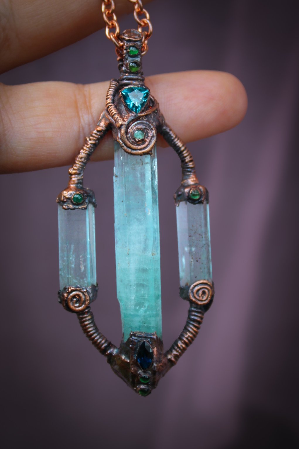Atlantian Energetic capacitor. Copper necklace made with Green beryl, blue sapphire, blue topaz, emeralds, chrome diopside.
