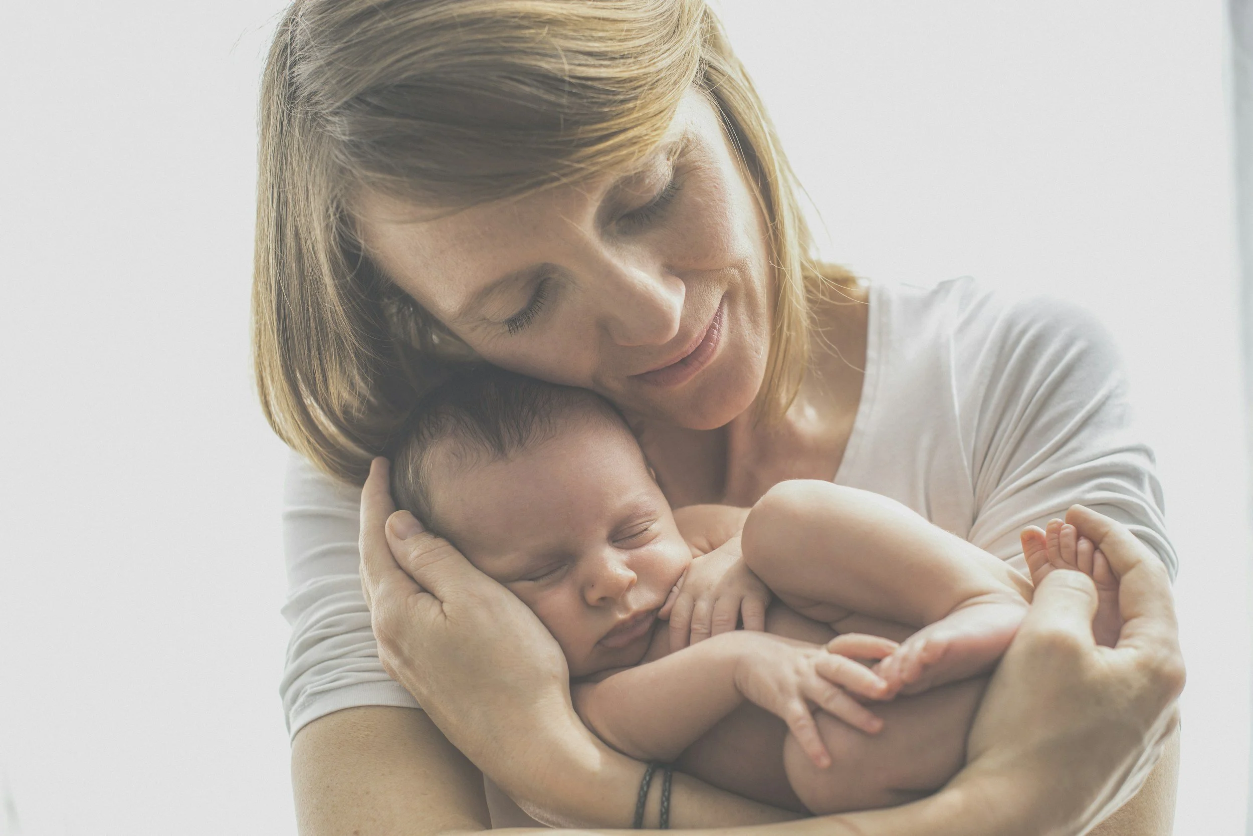 infant with torticollis in basket being treated by occupational therapist
