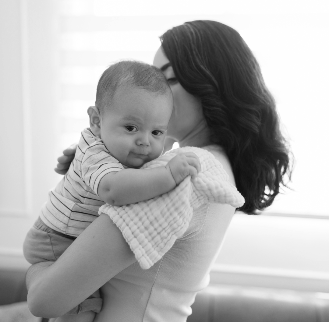 mother holding reflux baby upright