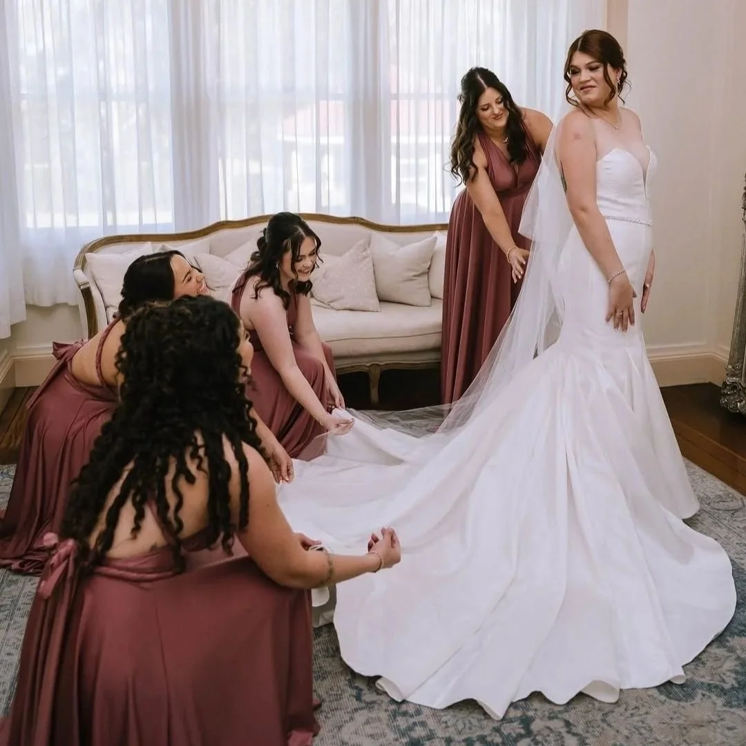 ride wearing  chapel veil with her bridesmaids.