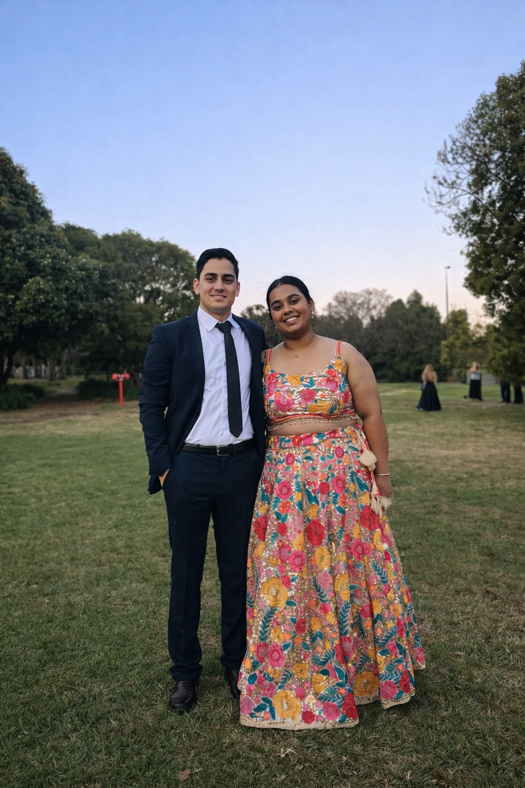 Perfectly tailored formalwear for a special event — custom-altered suit and floral gown with flawless fit.