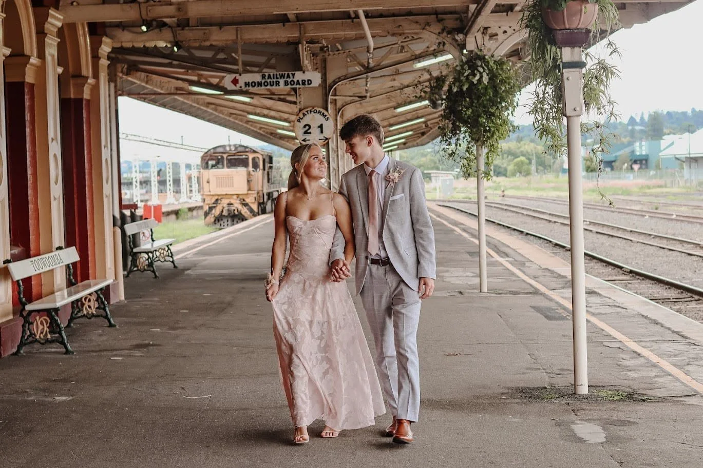 Tailored suit and blush formal gown for school formal.