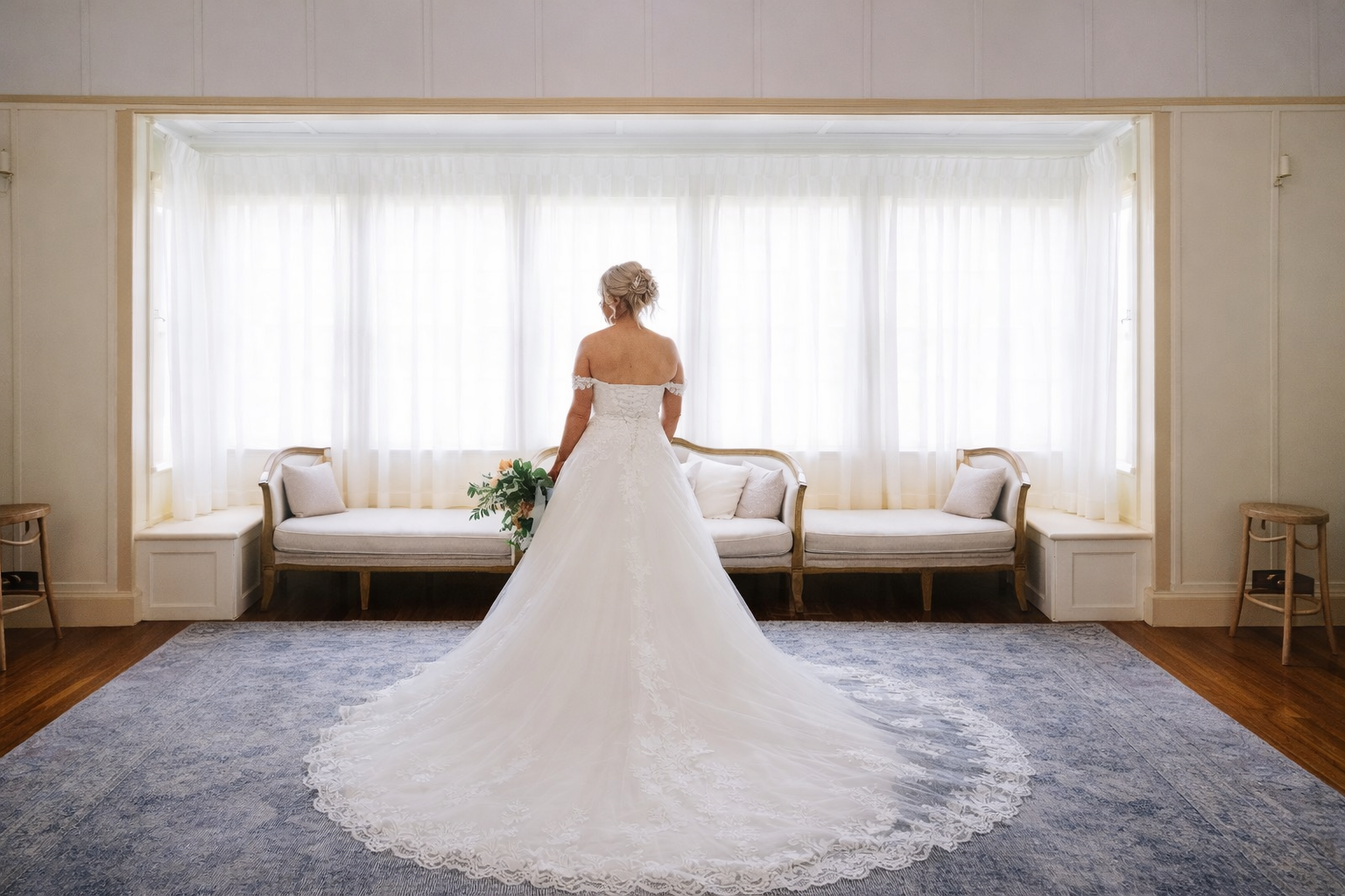 Bride getting ready with Rachel's Custom Sewing's professional wedding day steaming and styling service