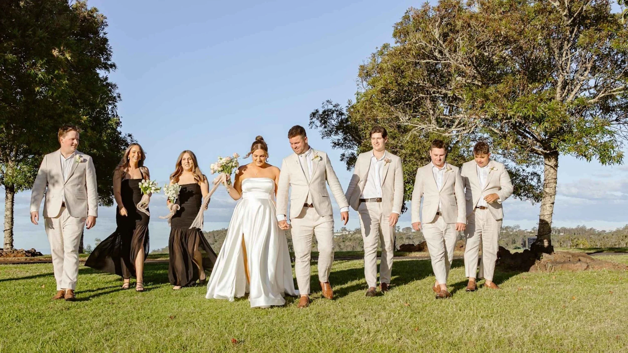 bride, Groom, and groomsmen in suits