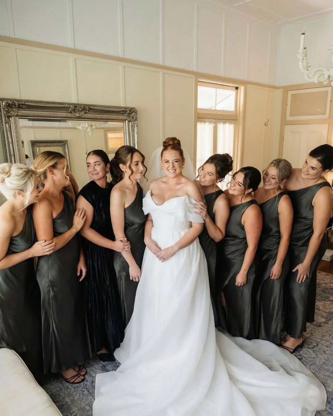 Pregnant Bride in wedding dress with Bridesmaids