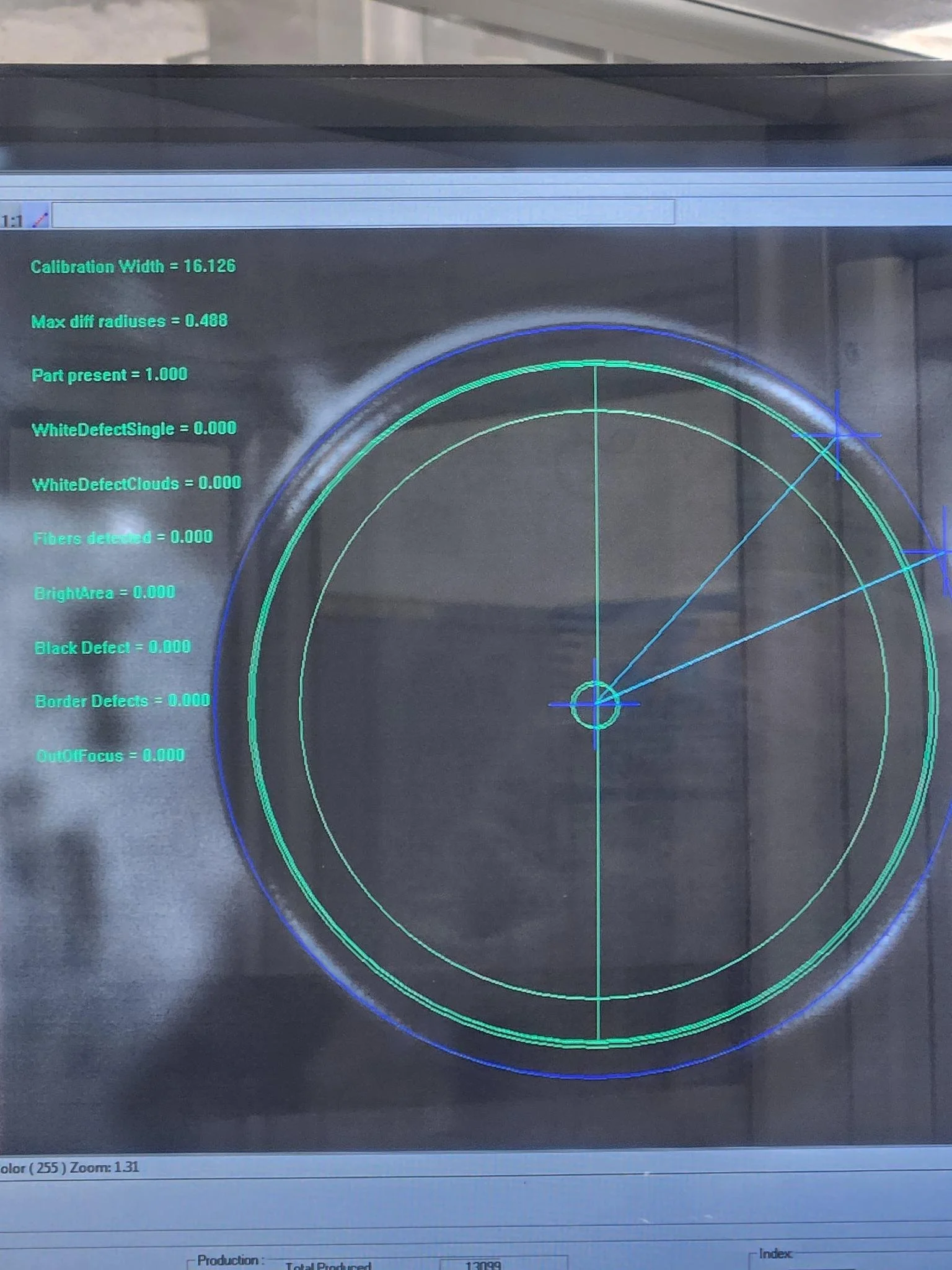 Computer screen displaying a calibration chart with measurement data and circular grid lines. Vision inspection, pc based.