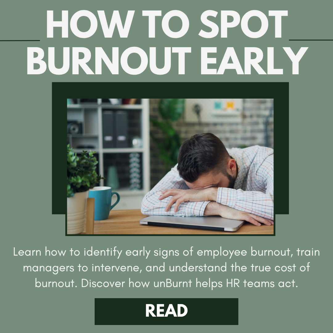 A person resting their head on a desk with a laptop, indicating exhaustion, surrounded by office items, with text overlay about spotting early signs of burnout.