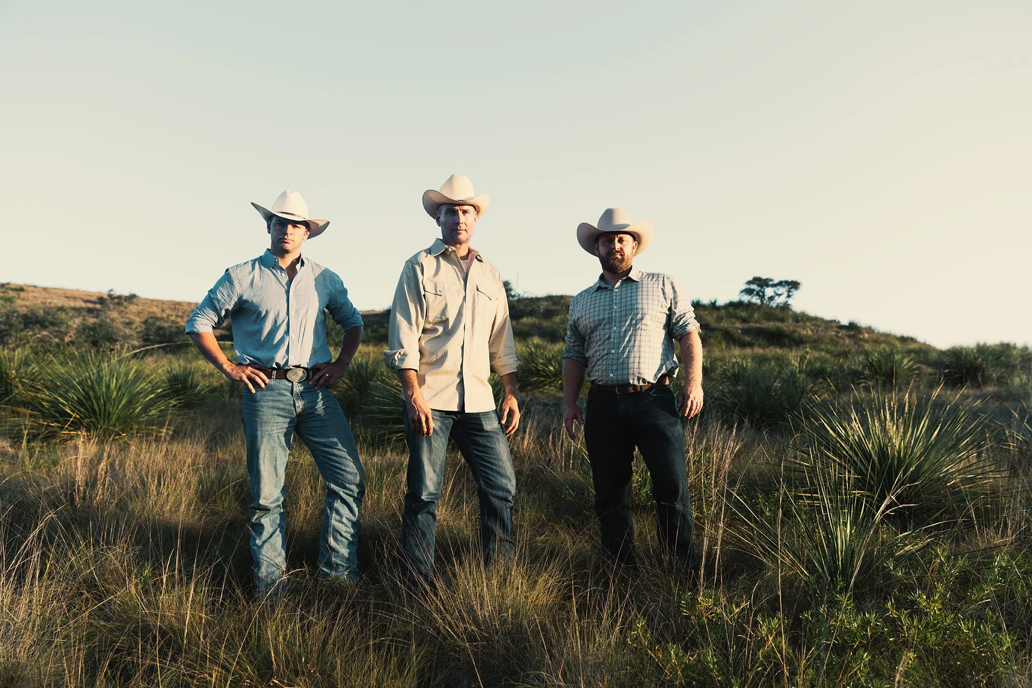 French Fox Design: Desert Door Texas Sotol, Lifestyle Photography: Three Men in Cowboy Hats and Jeans in Texas Sotol Field