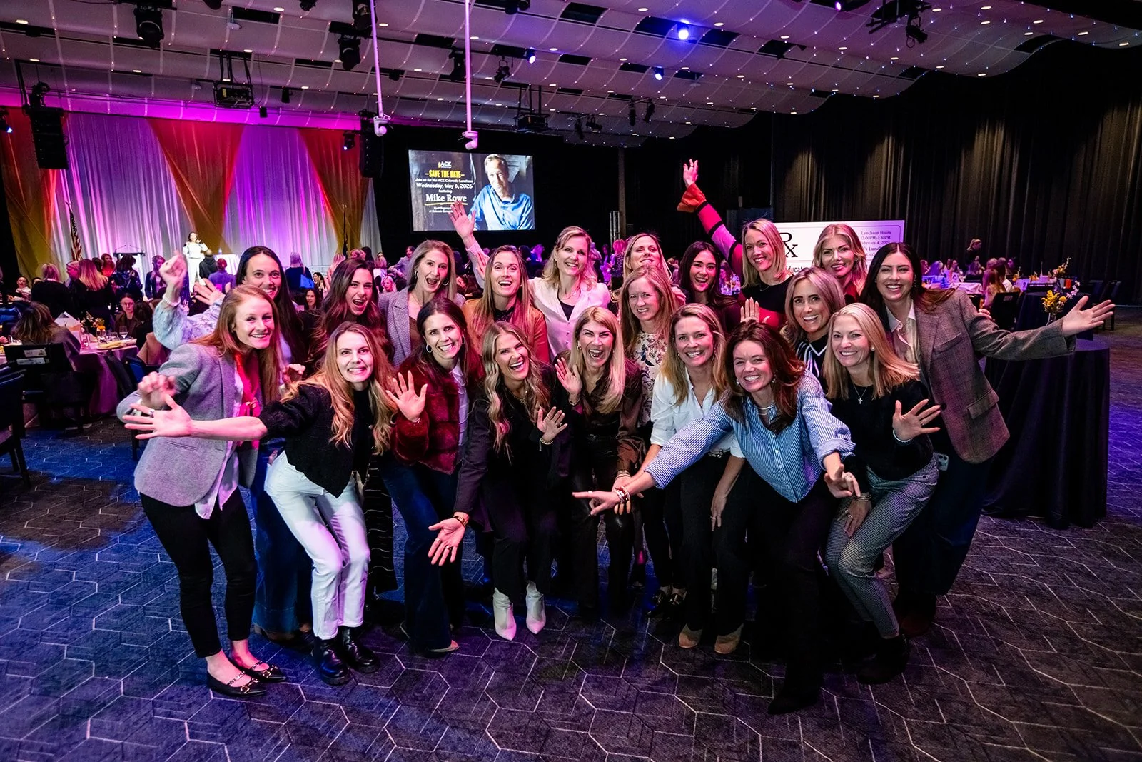 a group of woman pose for a photo with excitement