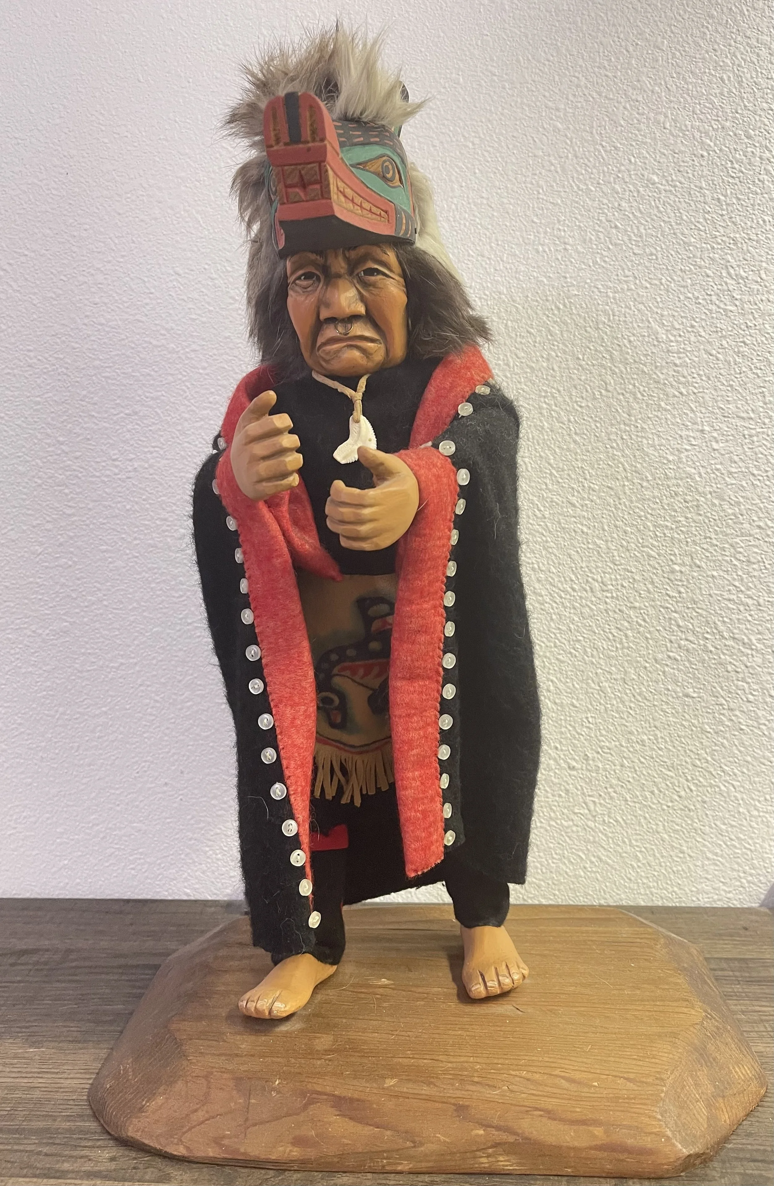 Kwakiutl wolf dancer, chief sheild on back of button blanket. Carved by Shona Hah 1977.jpg