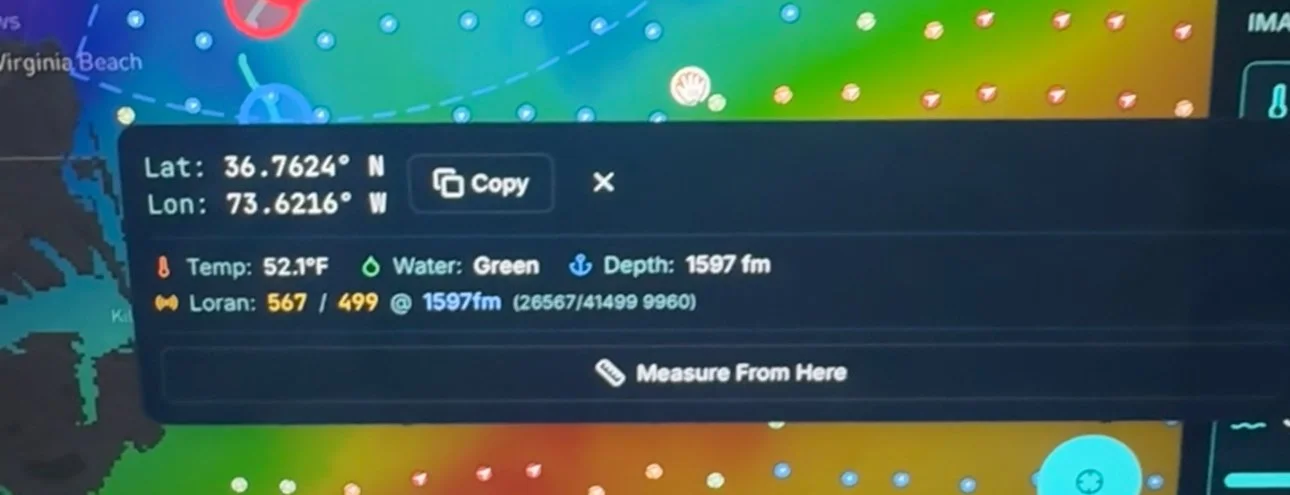 Screen displaying geographic coordinates, water condition, temperature, and depth for a location in Virginia Beach, with a colorful map background.