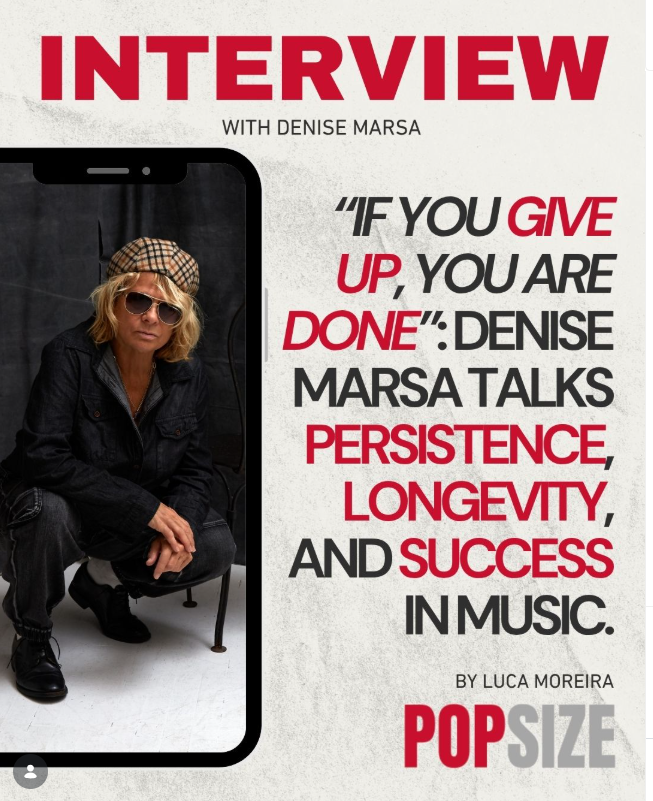 A woman in sunglasses, a plaid hat, black jacket, and black pants crouches next to a large smartphone screen displaying her. The background is mostly white with red and black text about an interview with Denise Marsa and her quote about persistence, longevity, and success in music, published by PopSize.