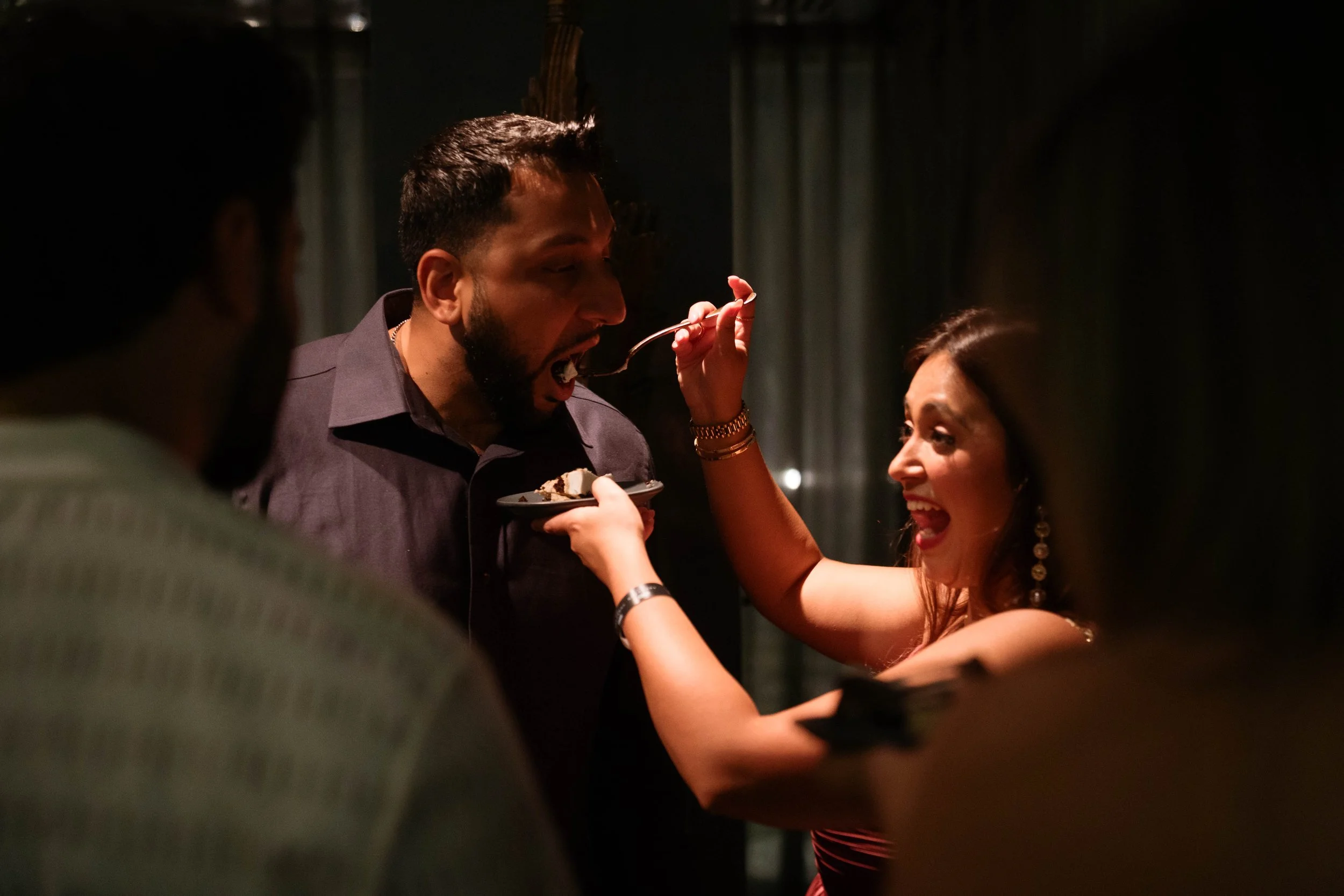 couple feeding cake during Catbird Dallas birthday celebration