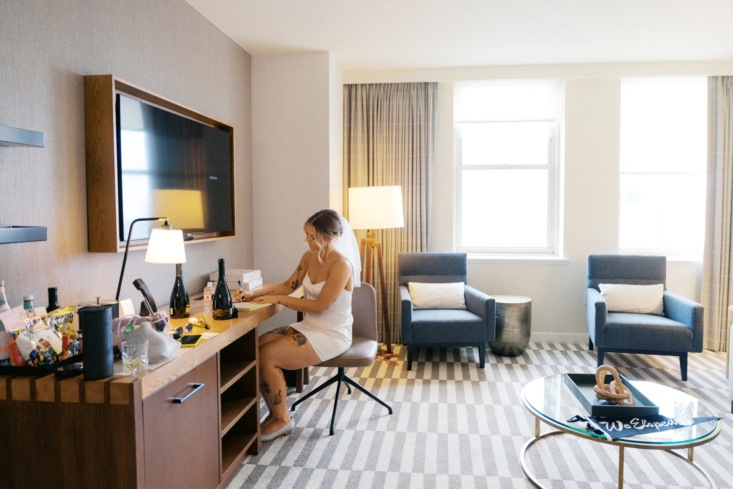 A quiet moment writing vows near window at Kimpton Harper Hotel