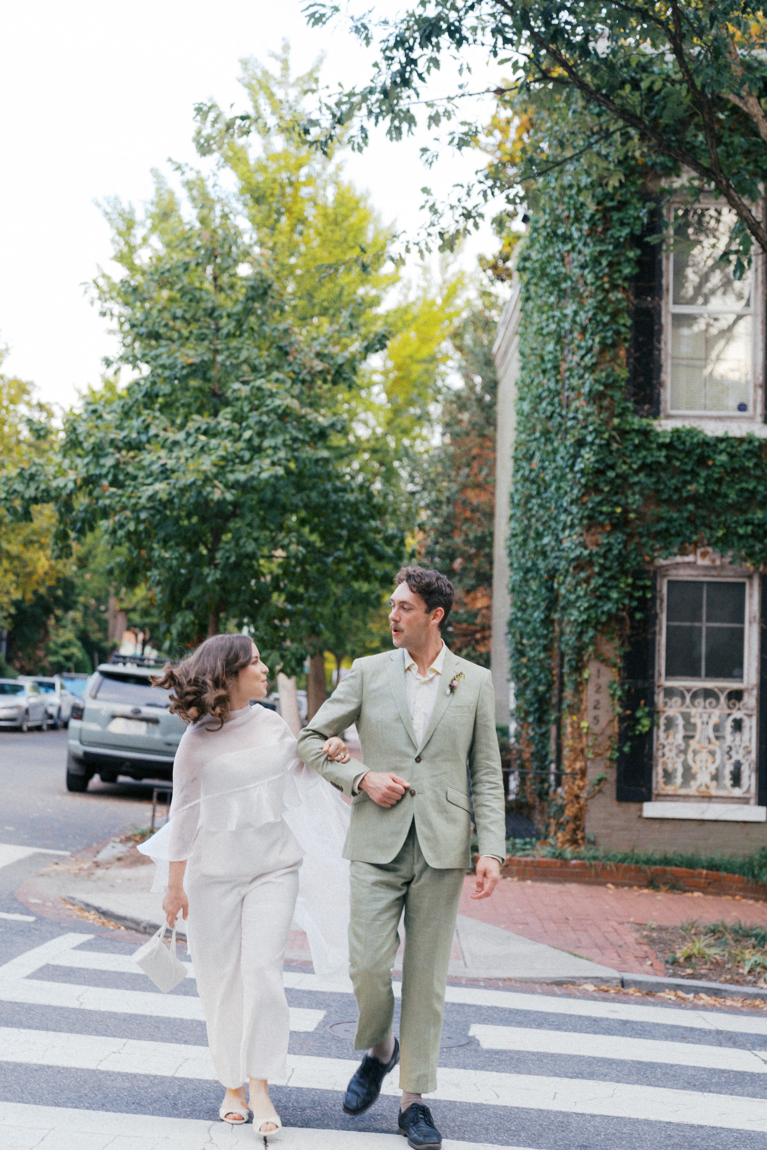  couple walking through historic georgetown washington dc after elopement 