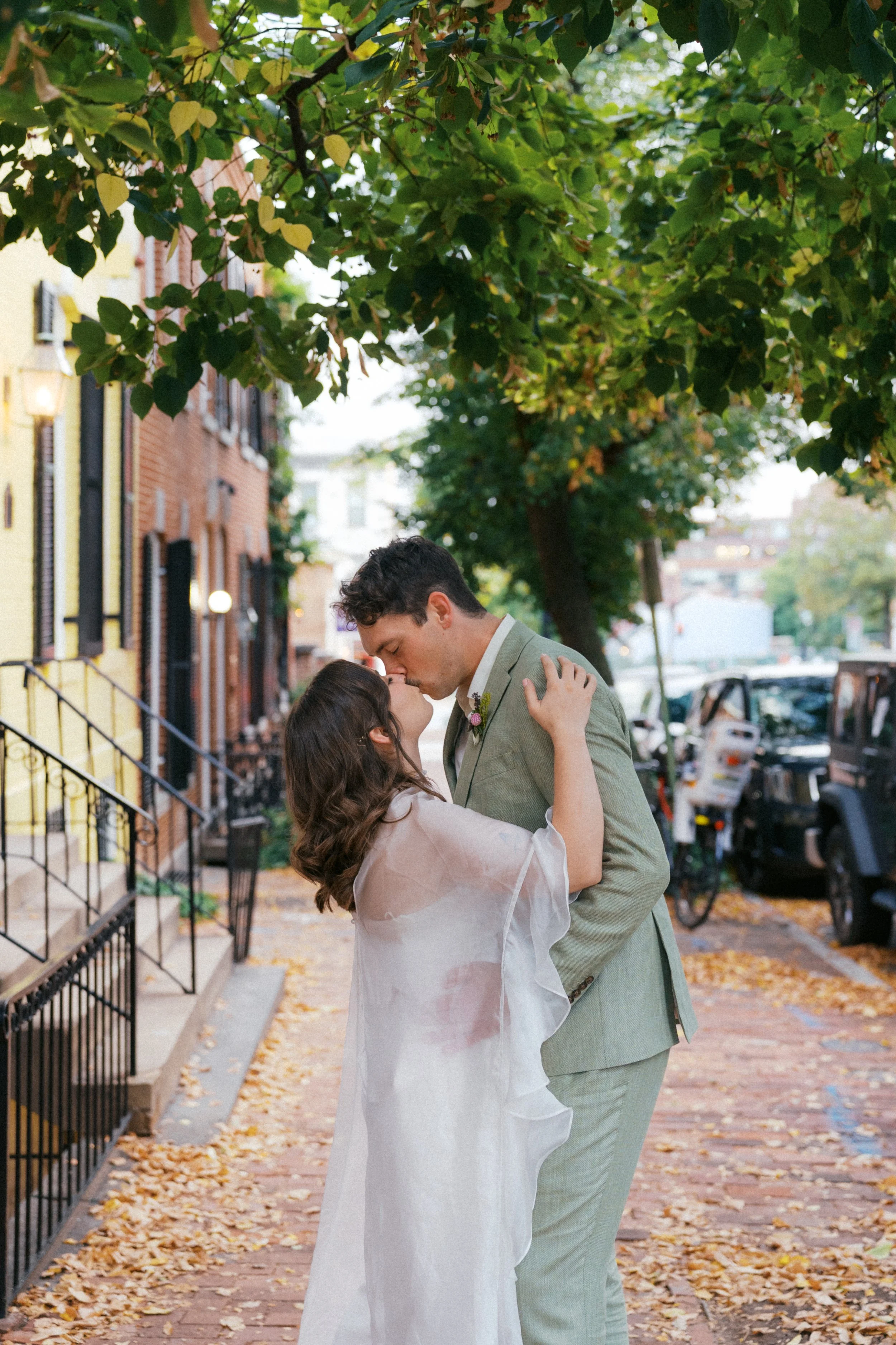  couple kissing in front of colorful georgetown row houses washington dc 