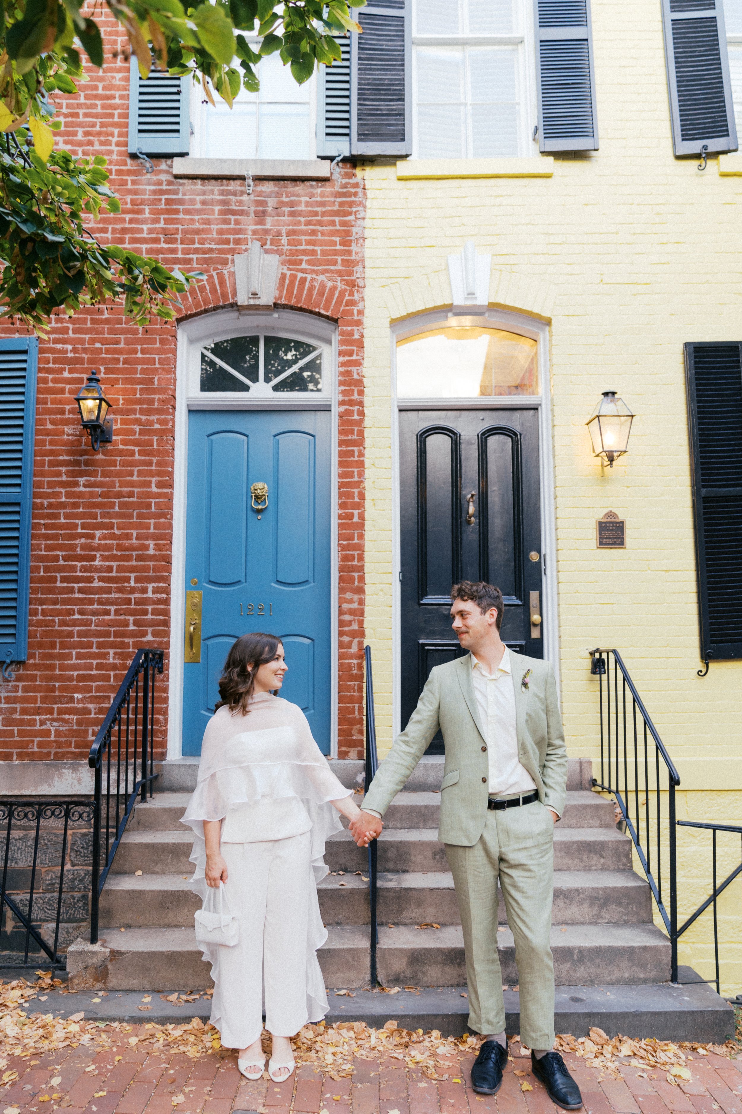  couple standing in front of colorful georgetown row houses washington dc 