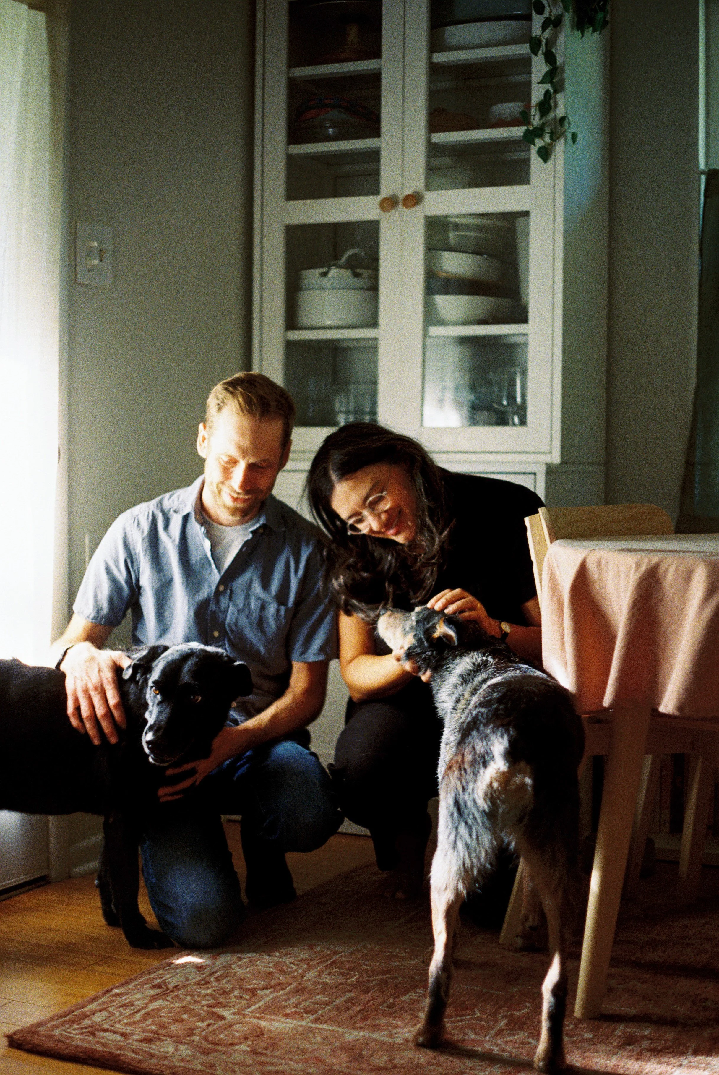 Couple at home in Fort Worth with dogs on a Sunday afternoon, shot on 35mm film