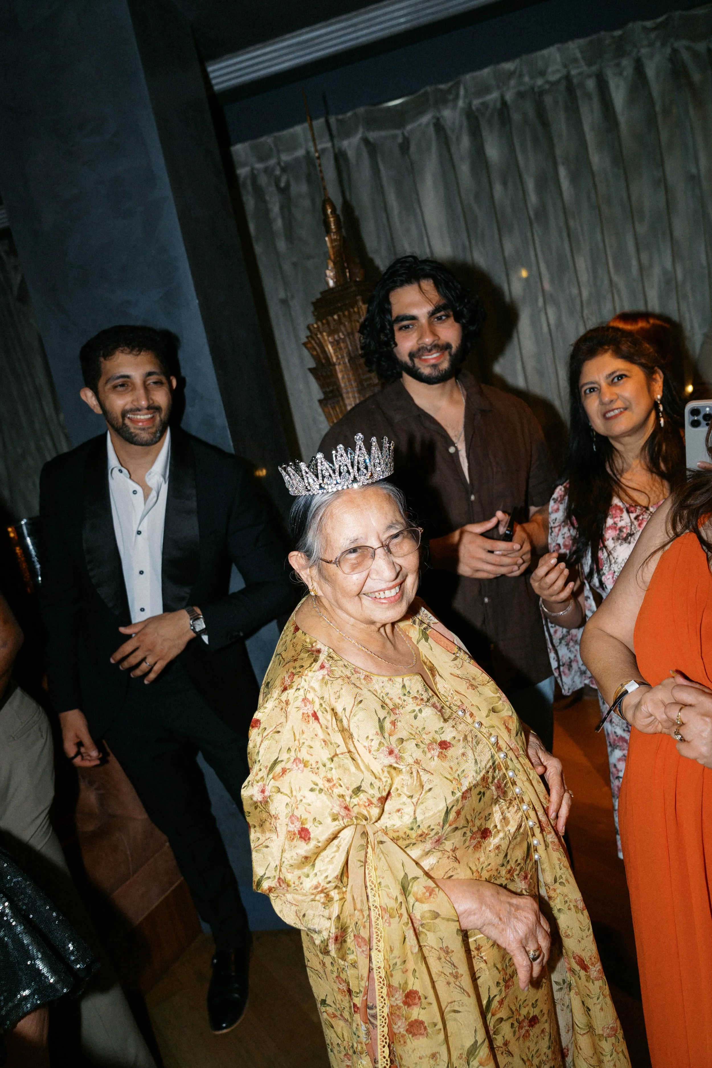 group photo with grandmother wearing crown at Catbird Dallas birthday celebration