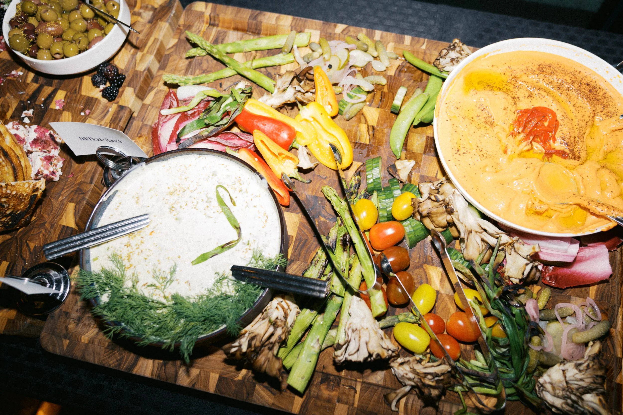 shared dinner plates and food at Catbird Dallas birthday party