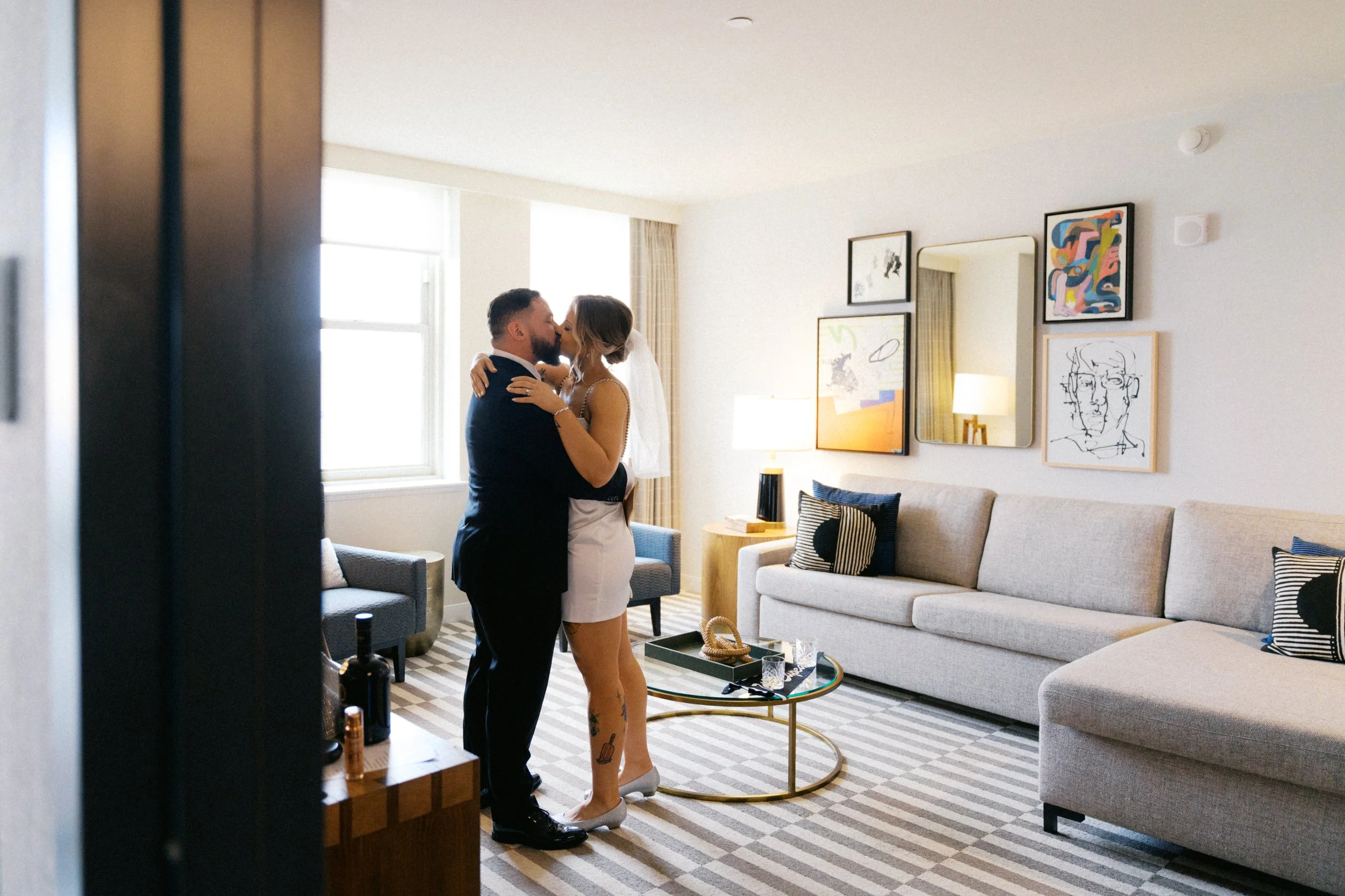 Couple sharing quiet moment near window at Kimpton Harper Hotel