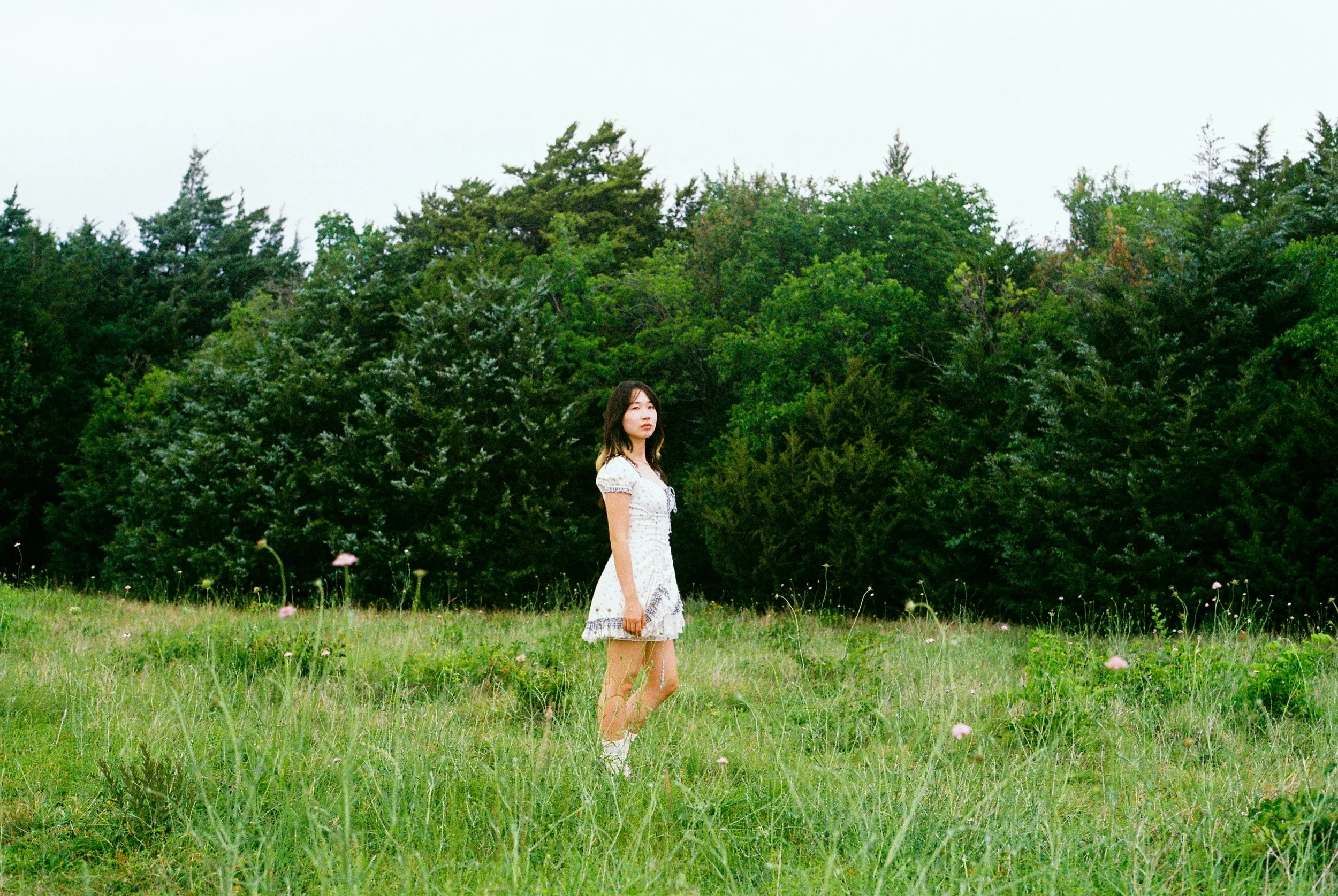 Editorial portrait outside in a field of wildflowers at Arbor Hills in Plano, Texas