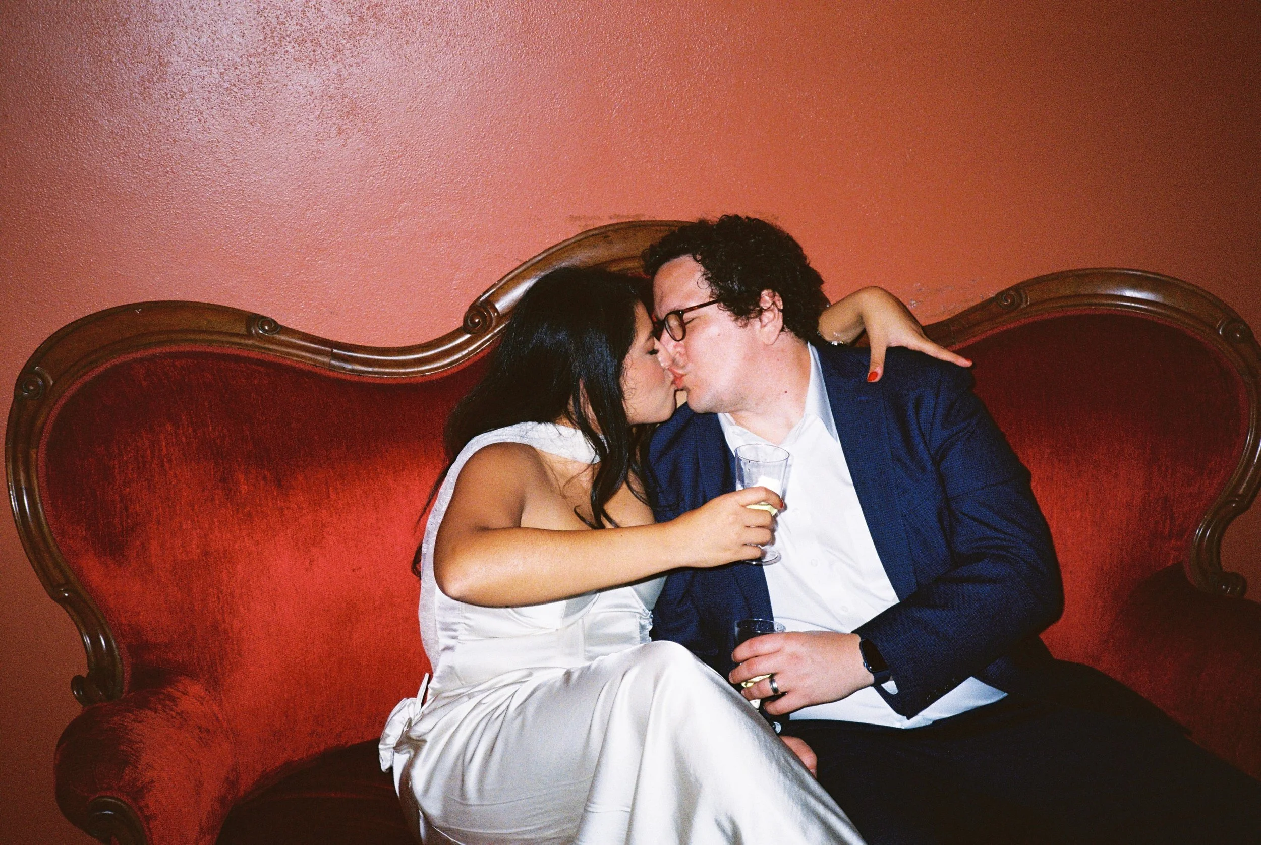 intimate wedding photo on film of couple at Texas Theatre in Dallas Texas