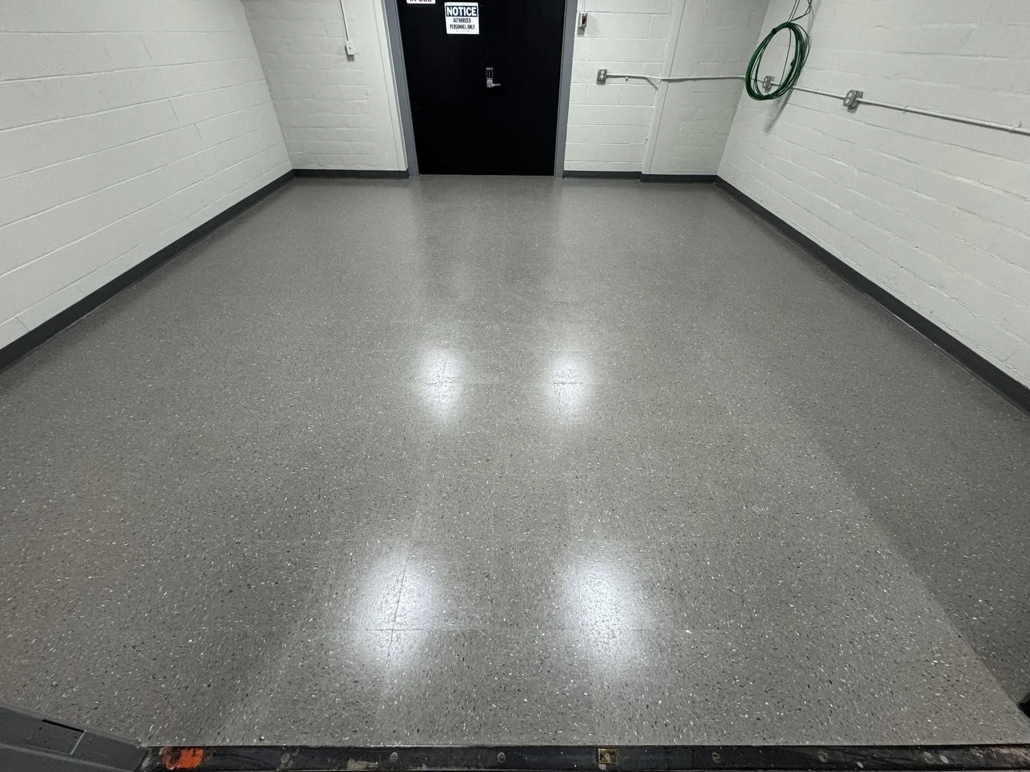 12,600 sqft - AHF Products - Iliad - Falcon Gray
2,640 LF - Roppe Corporation - 700 Series - 123 Charcoal
Floors prepped with HPS Schönox ZM self-leveler in areas, SL in others. Tile waxed with Betco - Hard As Nails floor polish. 
