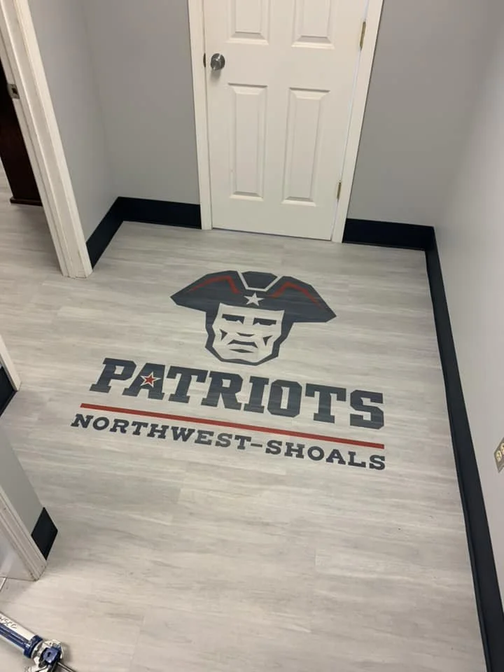 This one was a fun little project for Northwest-Shoals Patriot Softball! We teamed up with Interface, Roppe Corporation, and ADCUT - Advanced Cutting Technologies to make this small space a reality! 
•	Interface - Studio Set - A00701 Silverlight
•	In