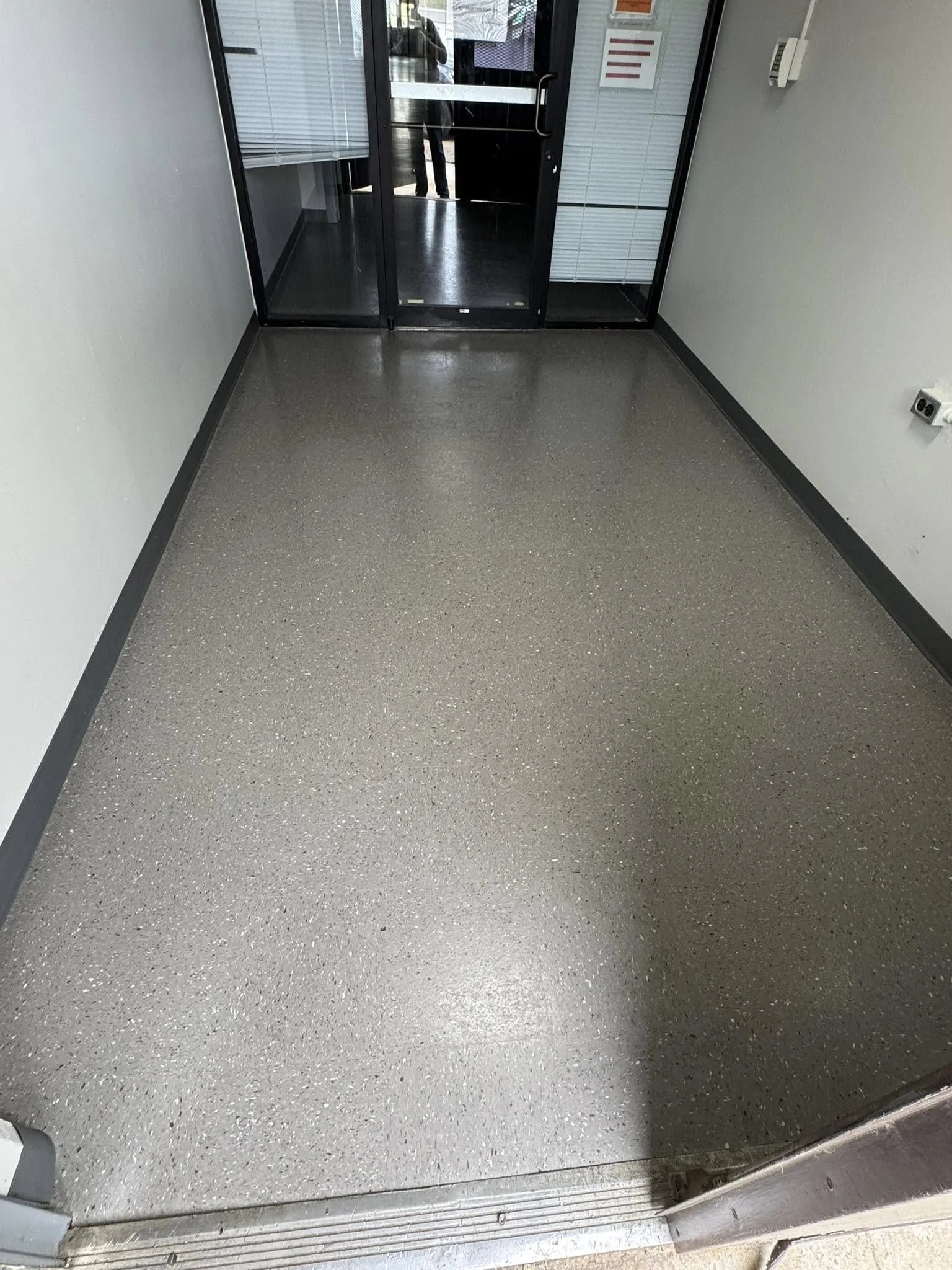 12,600 sqft - AHF Products - Iliad - Falcon Gray
2,640 LF - Roppe Corporation - 700 Series - 123 Charcoal
Floors prepped with HPS Schönox ZM self-leveler in areas, SL in others. Tile waxed with Betco - Hard As Nails floor polish. 