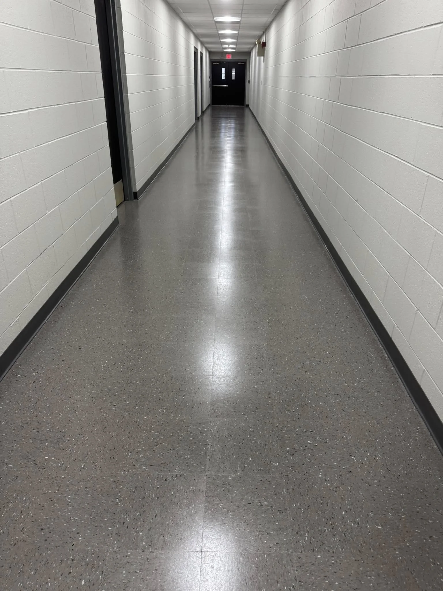 12,600 sqft - AHF Products - Iliad - Falcon Gray
2,640 LF - Roppe Corporation - 700 Series - 123 Charcoal
Floors prepped with HPS Schönox ZM self-leveler in areas, SL in others. Tile waxed with Betco - Hard As Nails floor polish. 