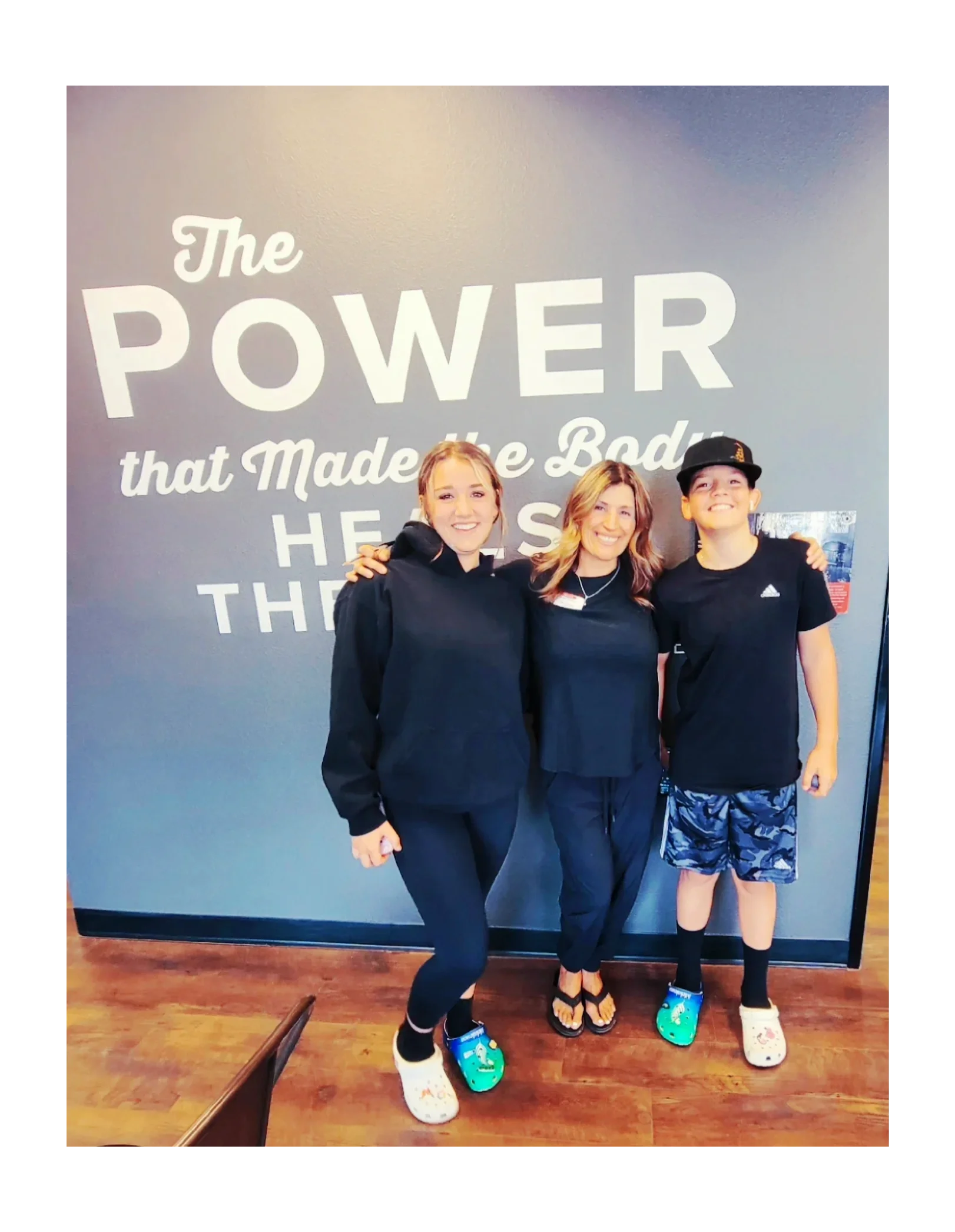 Young lady and young boy smiling with Dr. Rosie