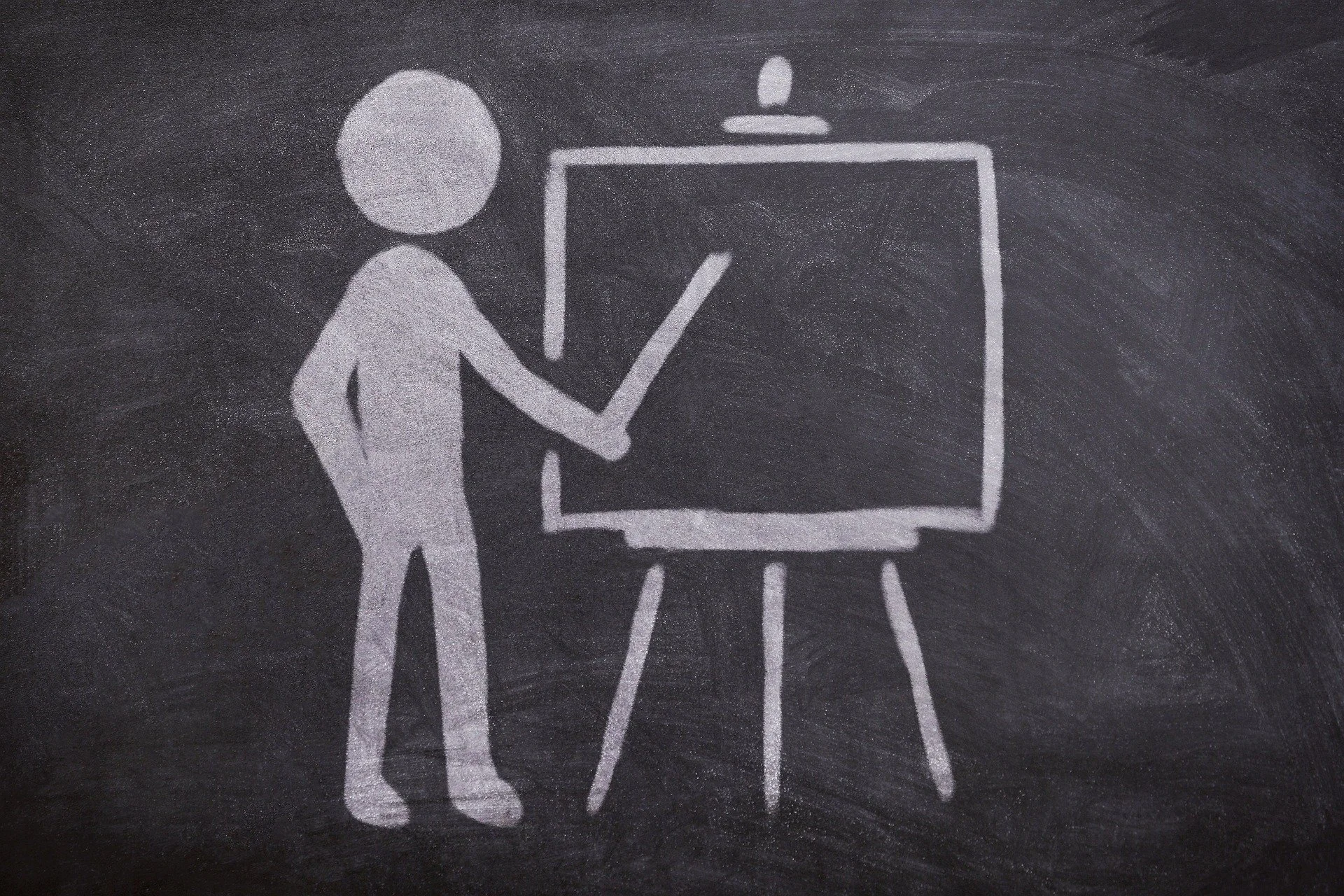 Chalk drawing of a person standing next to a presentation board with a pointer, on a blackboard background.