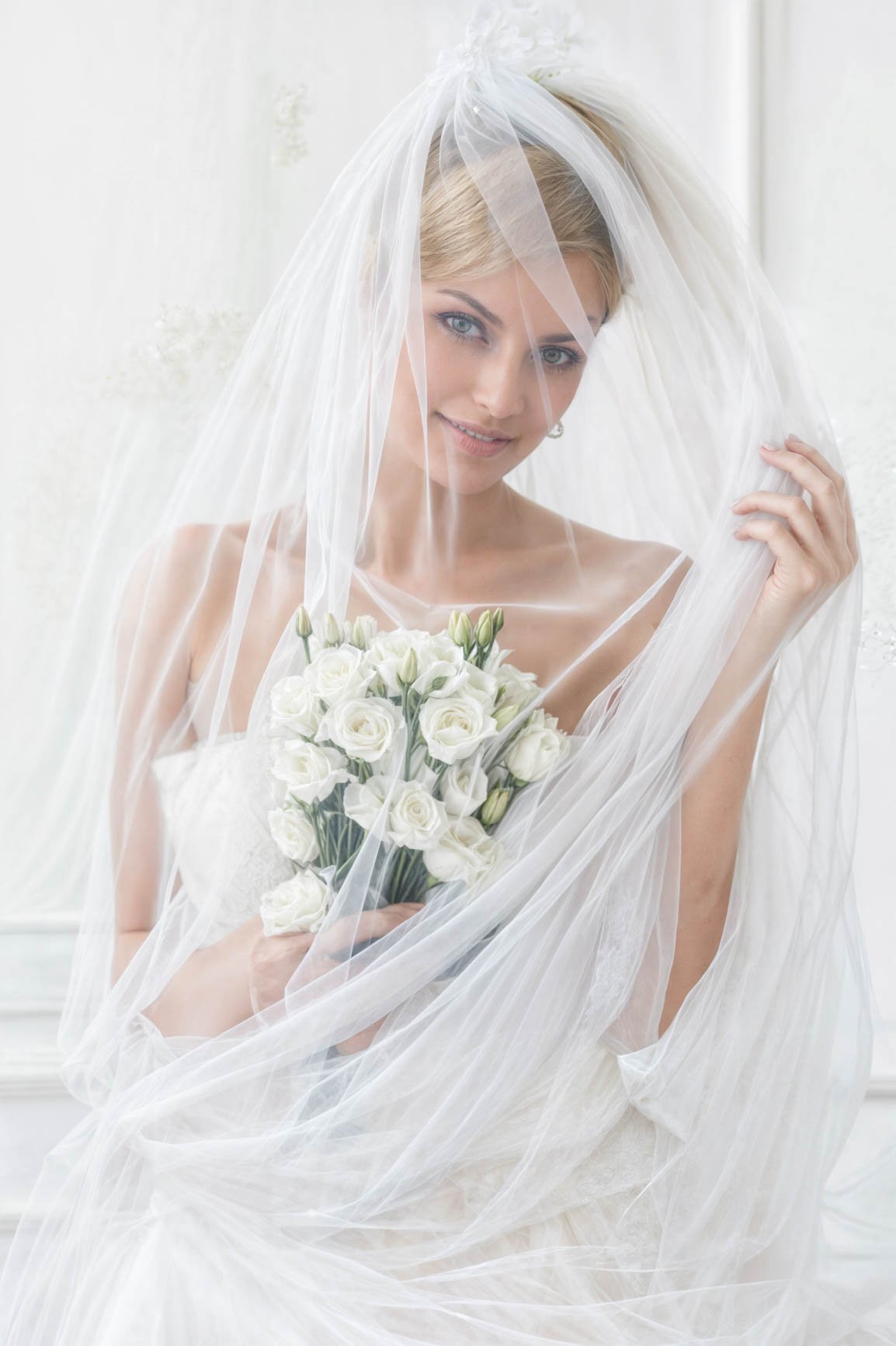 beautiful-bride-with-veil-bouquet-enhanced.jpg