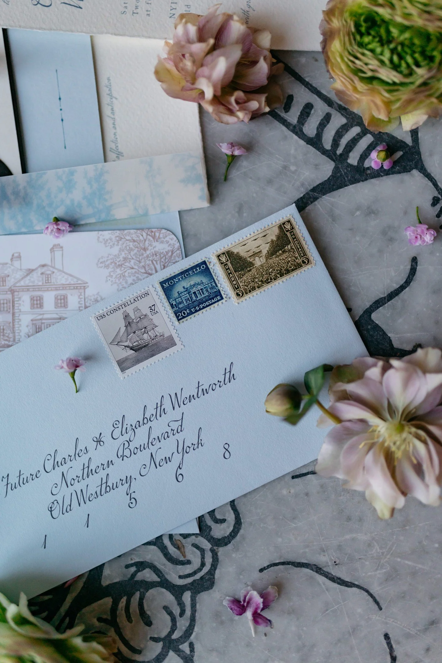 They say a picture is worth a thousand words.⁣
This one says: what's inside is worth your full attention.⁣
⁣
The sky blue tea-length envelope. Calligraphy. Vintage stamps. Before anyone even reaches for what's inside, the story has already begun.⁣
⁣
