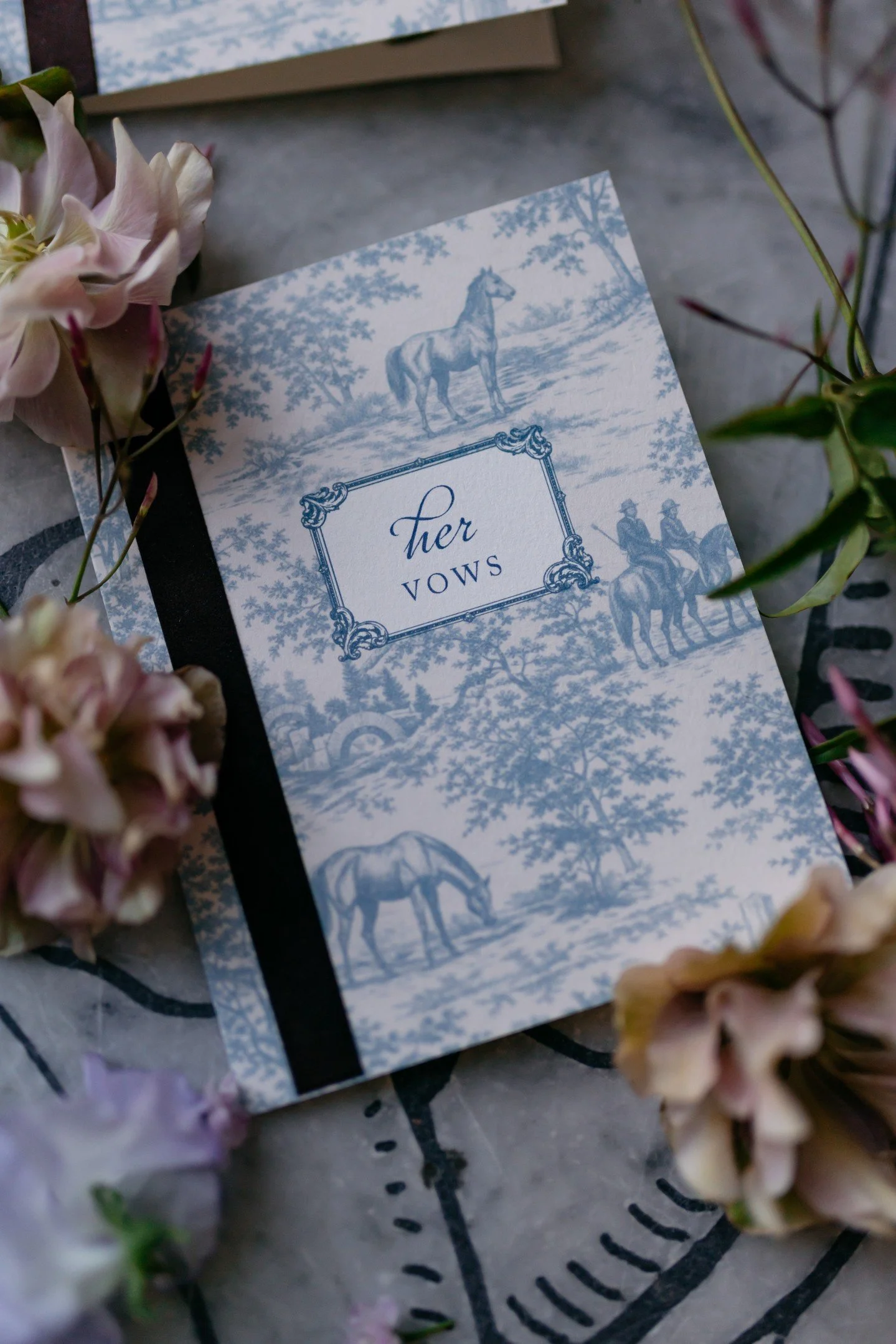 When Helena said modern Jane Austen, I took that and ran.⁣
⁣
Escort cards transformed into little mini books &mdash; open one and there's a note from the couple inside. Vow books with a velvet detail to mimic a book spine. And the table number in tha