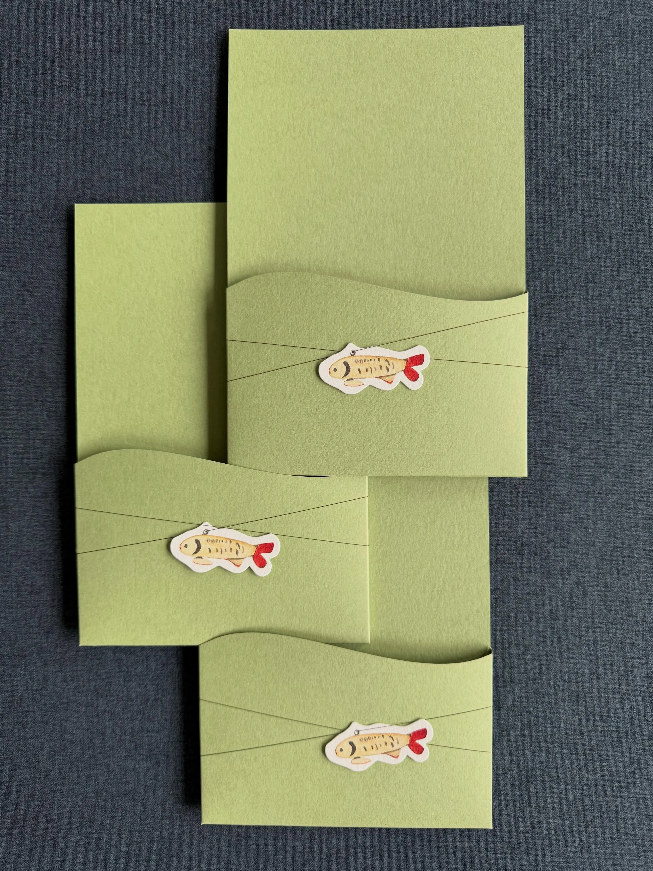 These fun pockets were custom made to hold some of T+B&rsquo;s favorite details, like these fish charms, painted from the MOB&rsquo;s collection of antique fishing lures. This is joyful one! With @theeventspaige and @ashleyfoxdesigns  #weddingdetails