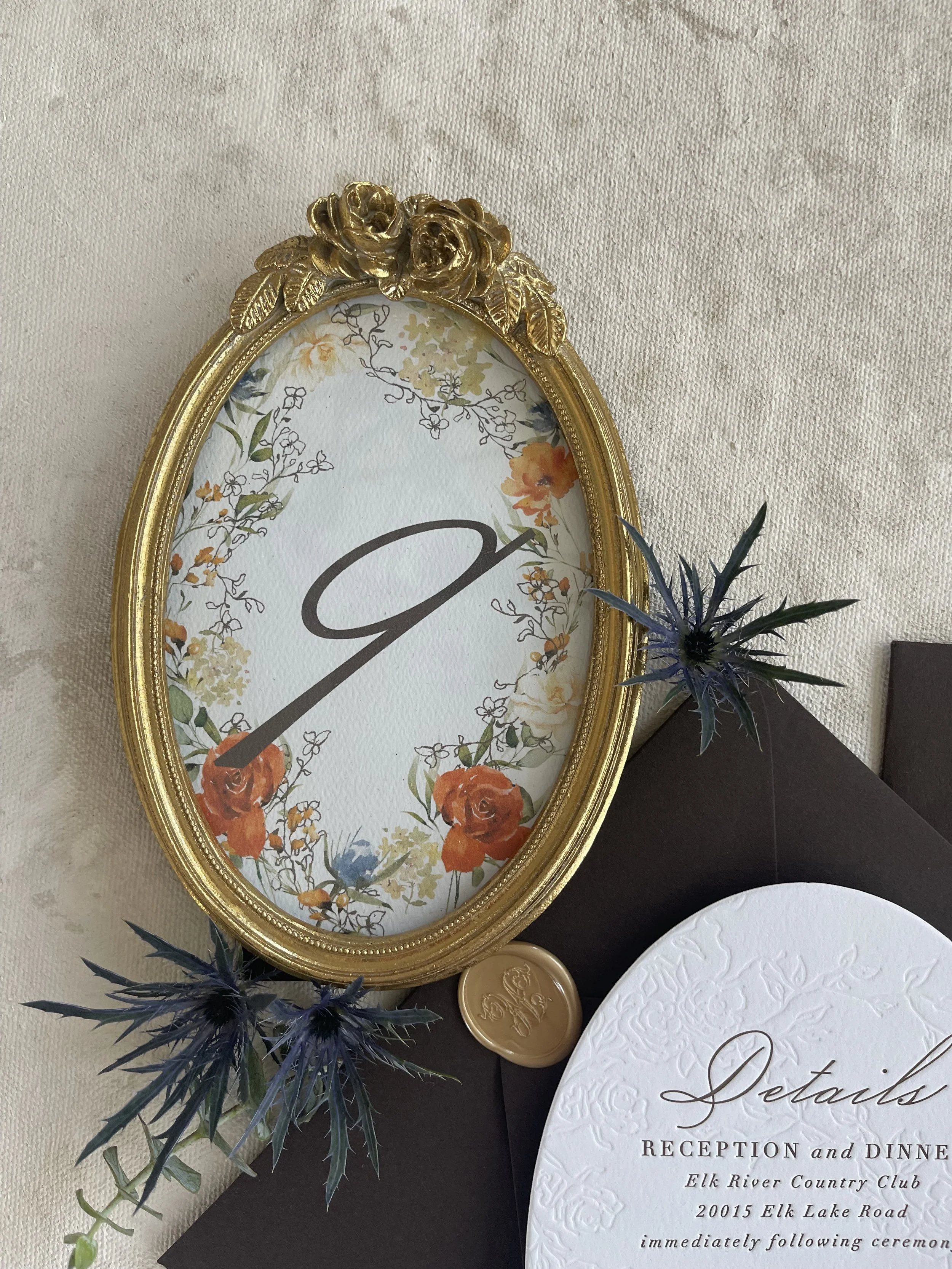 Oval vintage frame table number with custom monogram and watercolor fall floral wreath