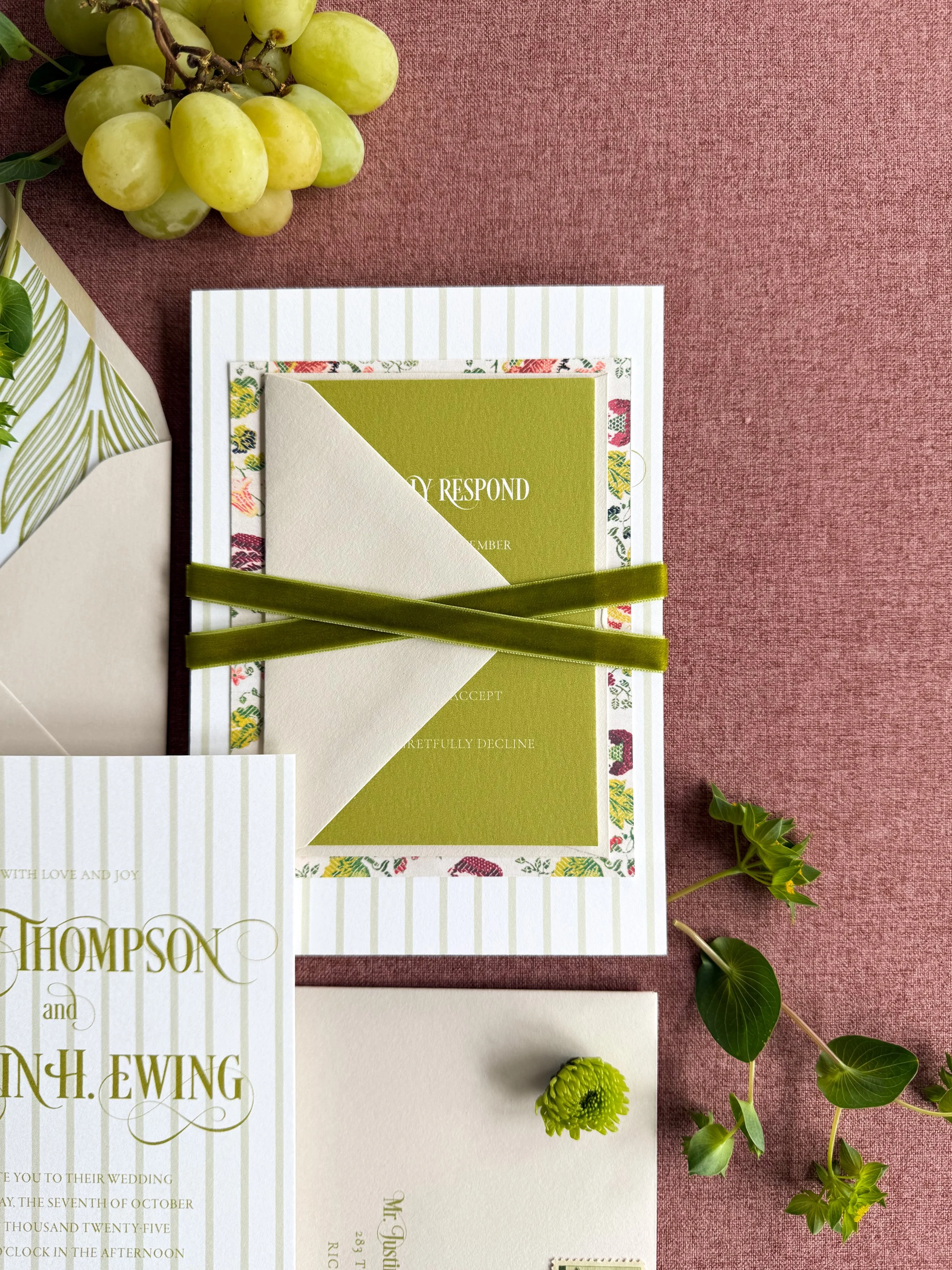 stacked wedding invitation suite with green velvet ribbon