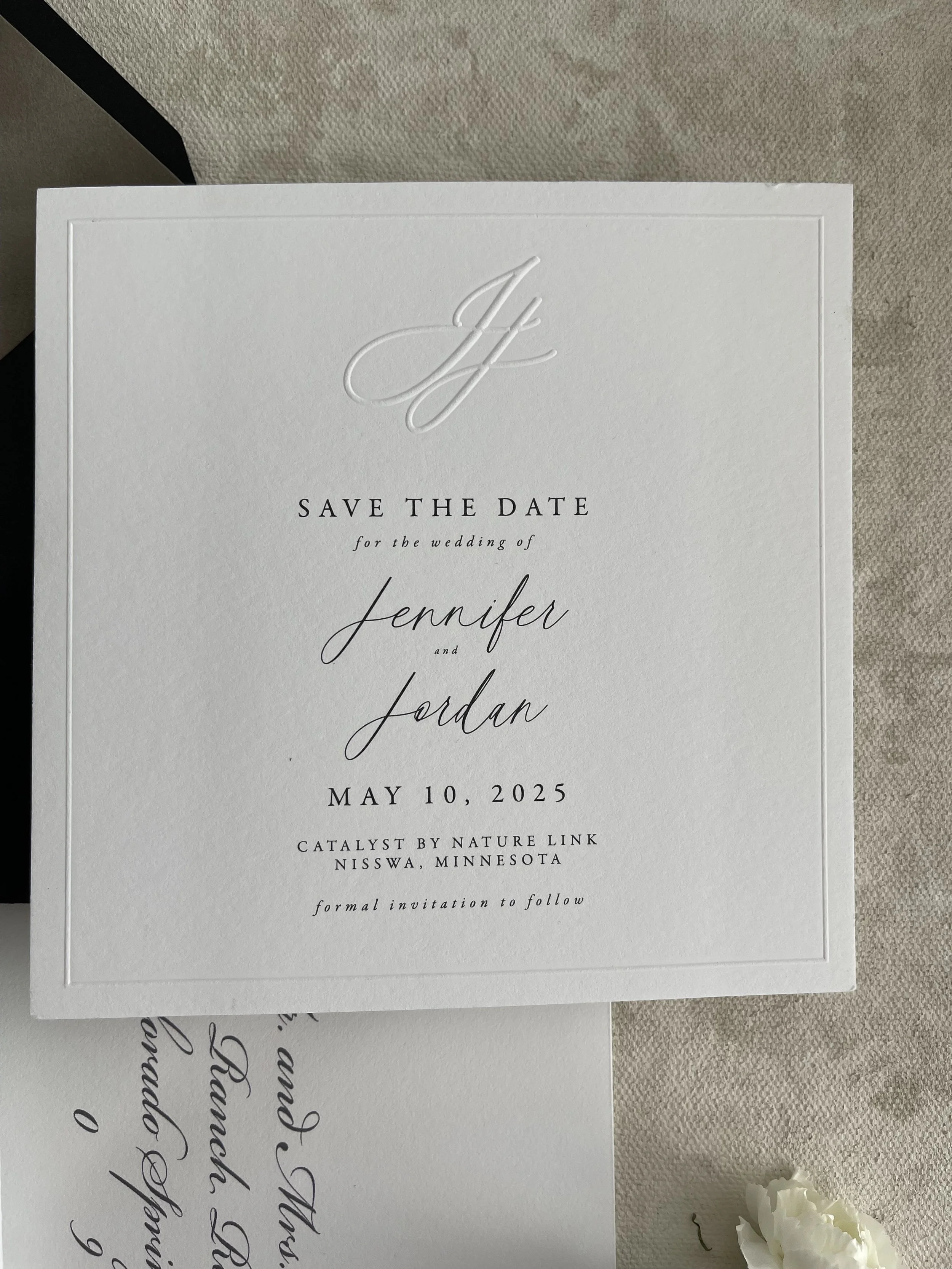 square save the date with embossed monogram and border