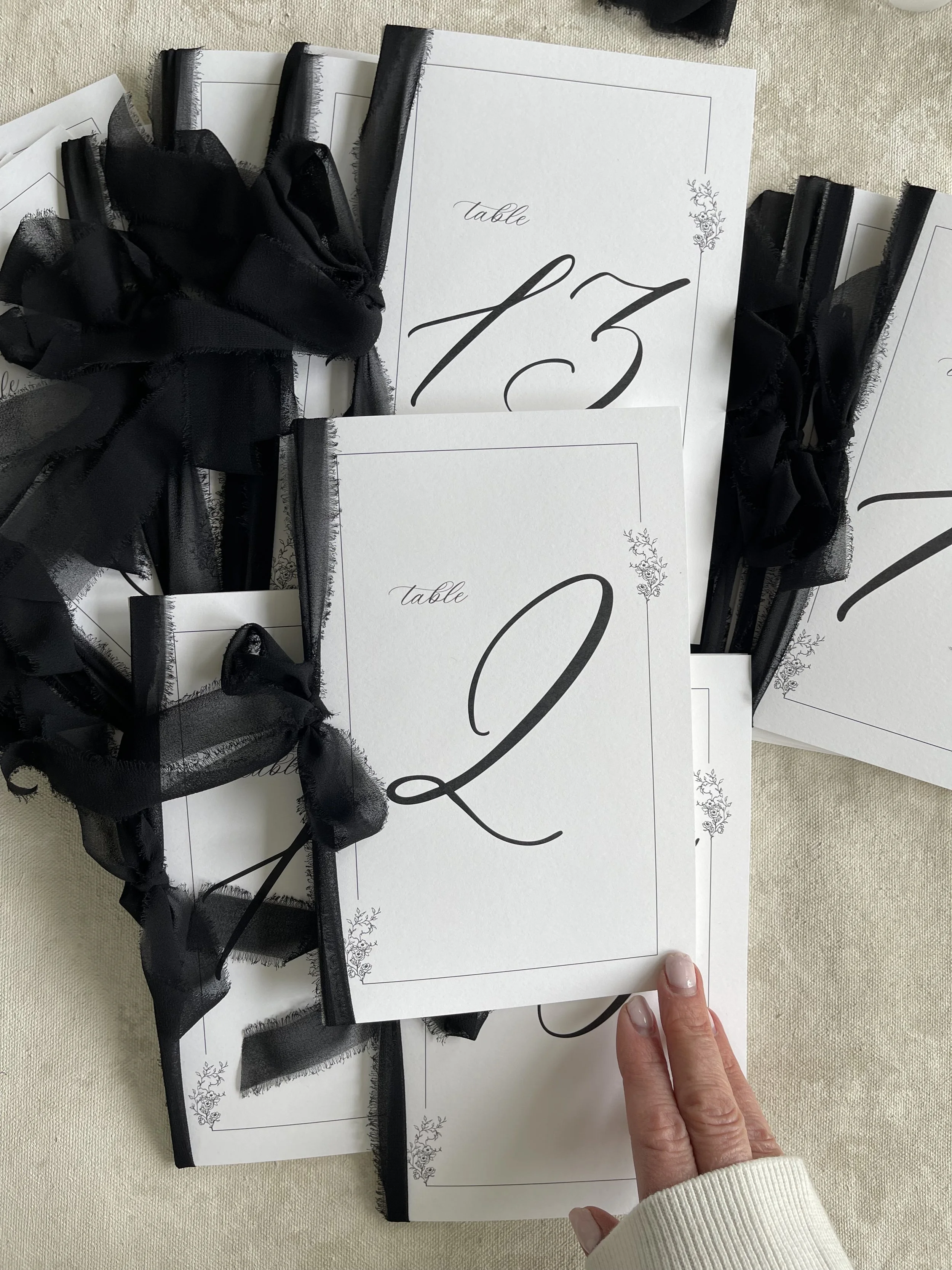 black-ribbon-tied-table-numbers-4.jpeg