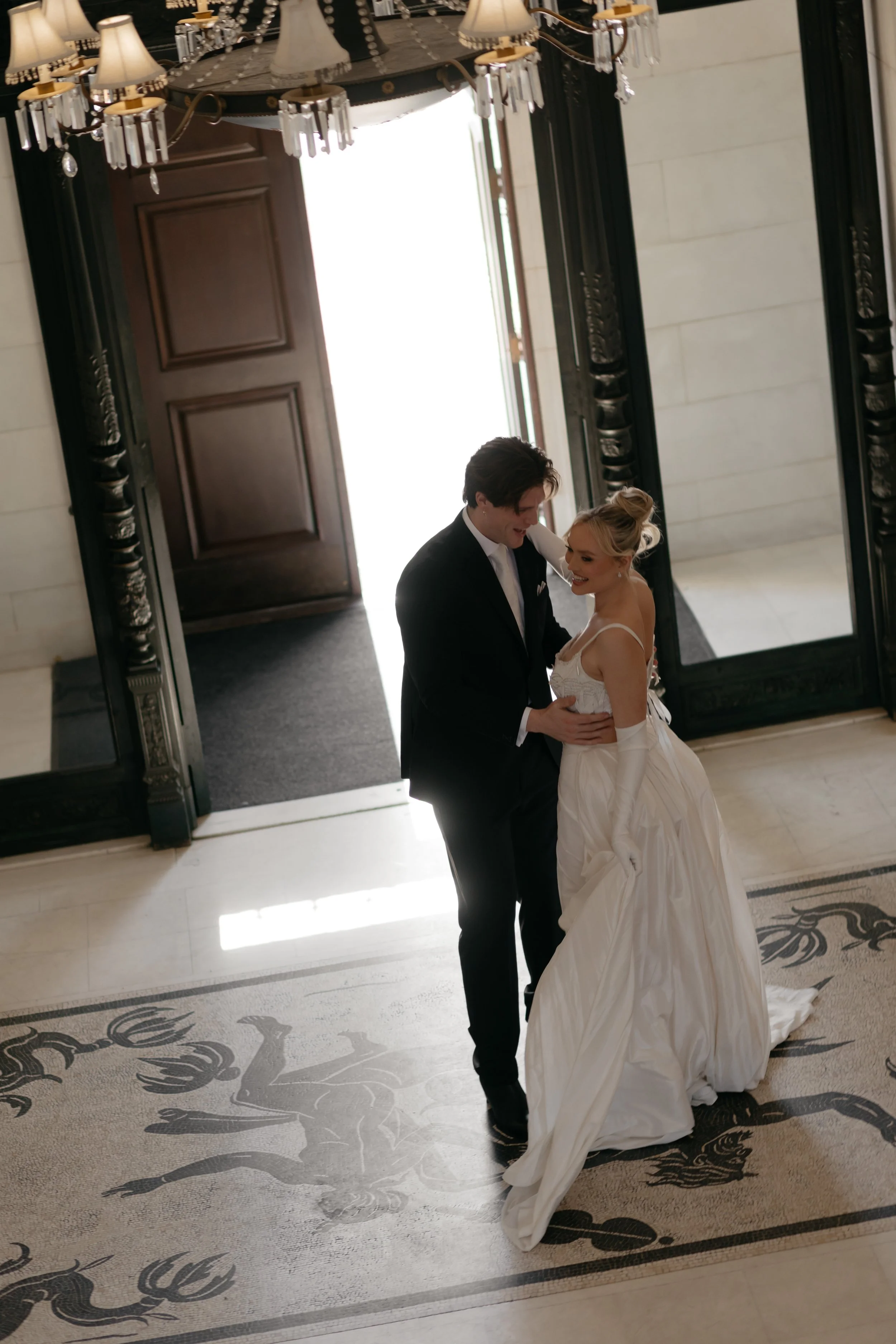romantic bride and groom at De Seversky mansion foyer