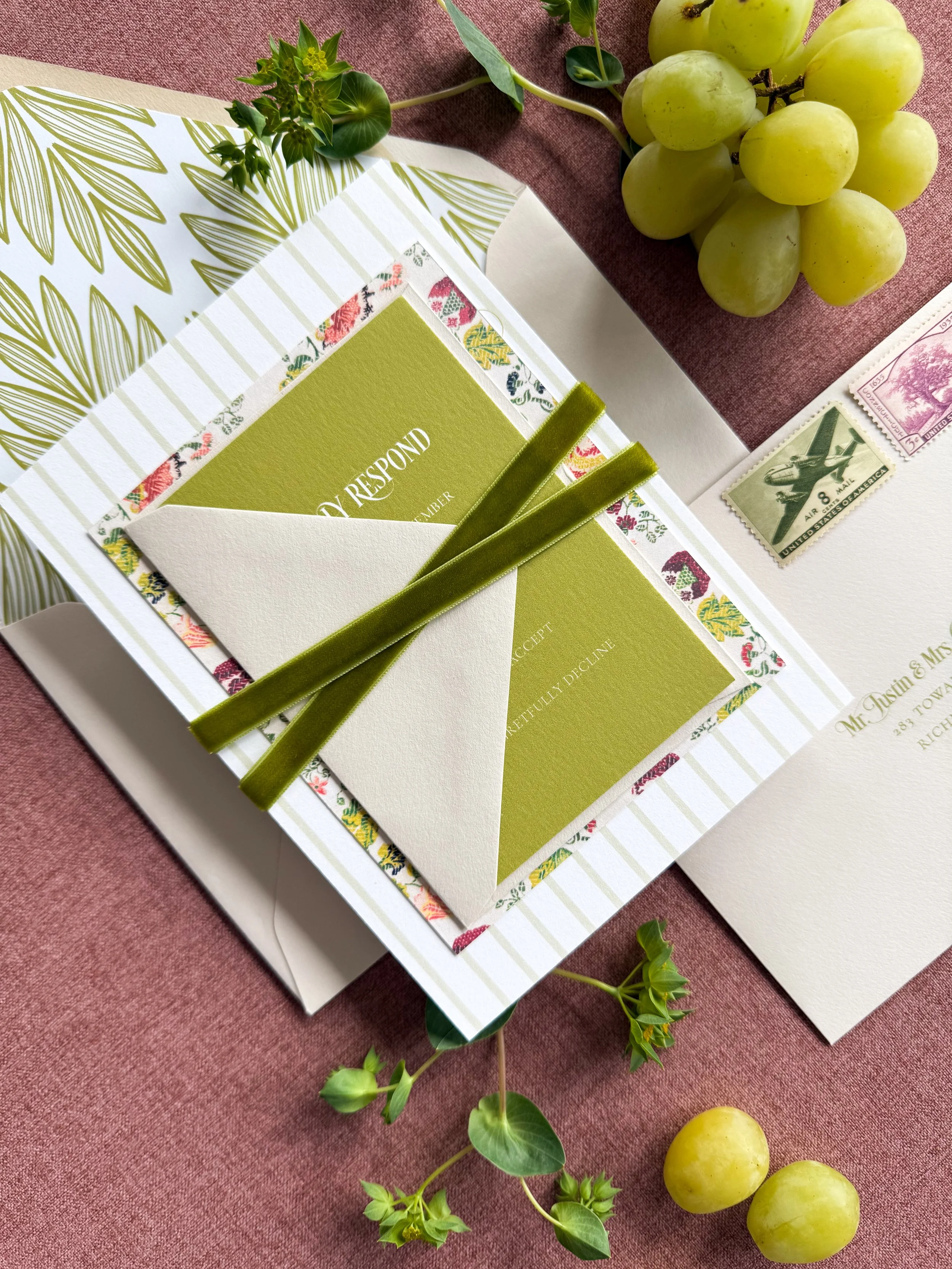stacked wedding suite with green velvet ribbon