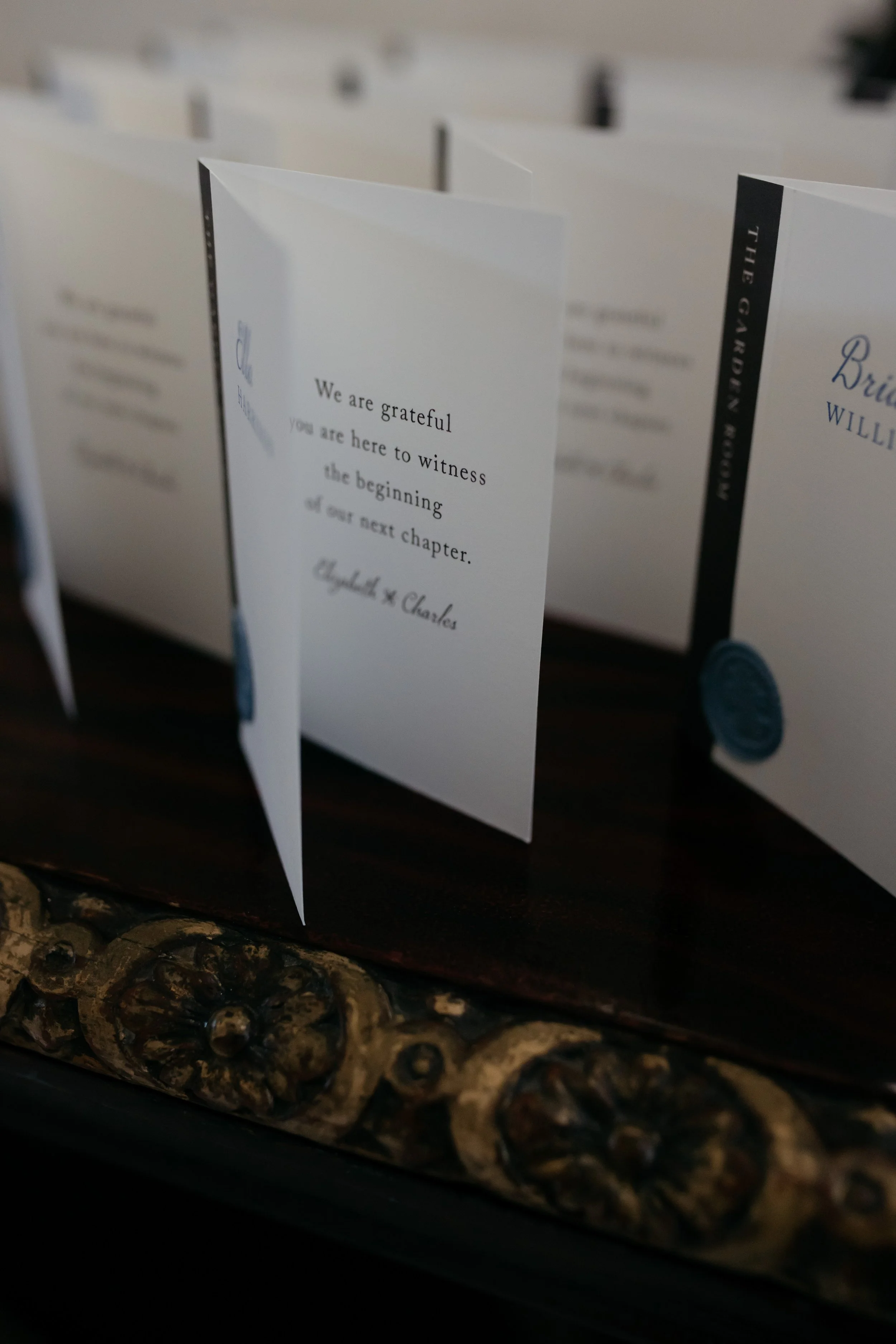 Escort cards with thank you message written inside