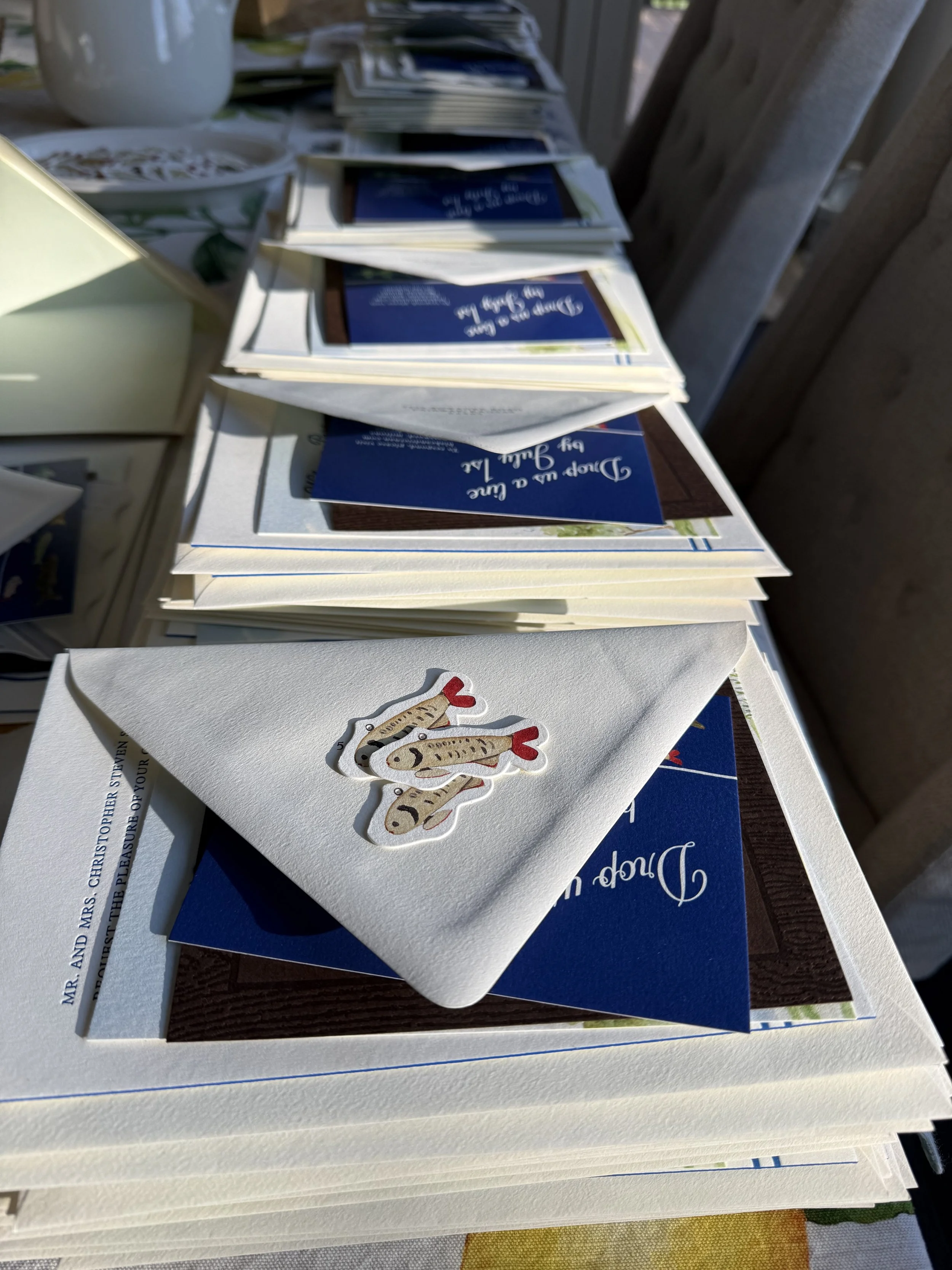 stack-of-wedding-invitations-during-assembly-process