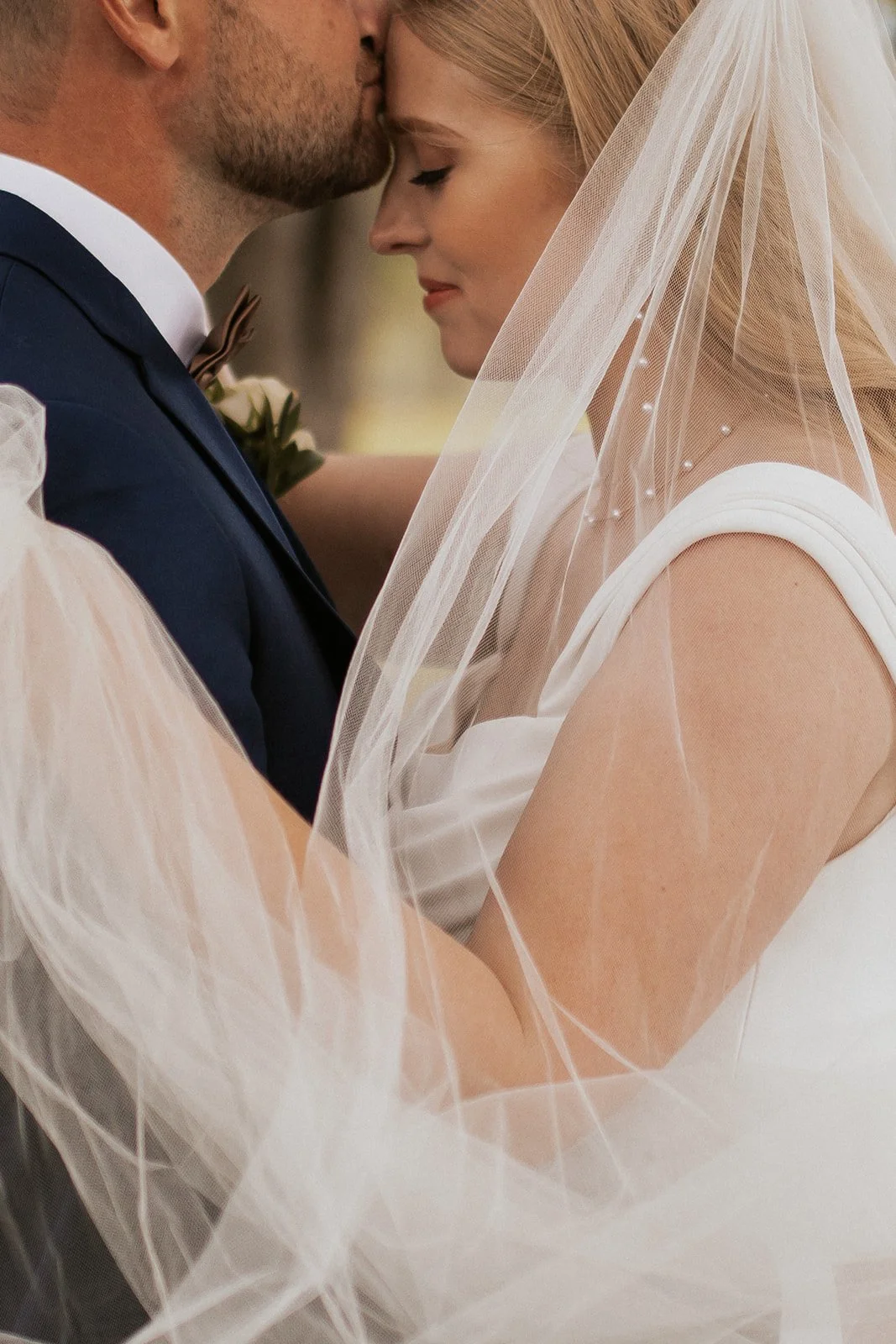 Bride in wedding veil close up portrait detail