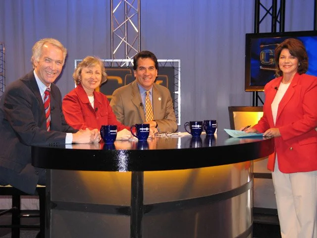 Seated on a television studio set, Council members Doug Linkhart (l), Jeanne Faatz, and Rick Garcia address public safety issues on Council Matters, hosted by Beverly Weaver.