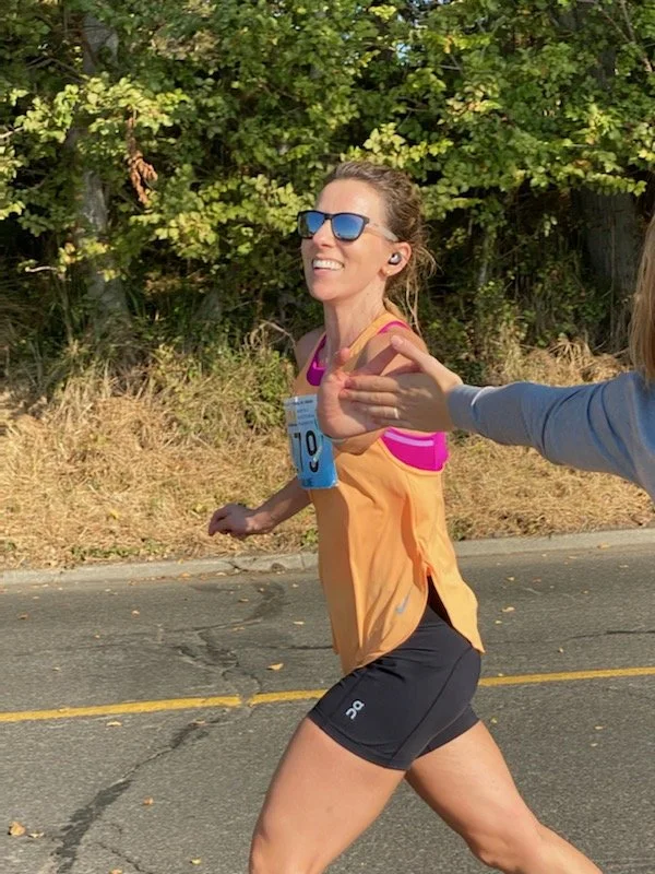 CarolineHighFiveRunning.JPG