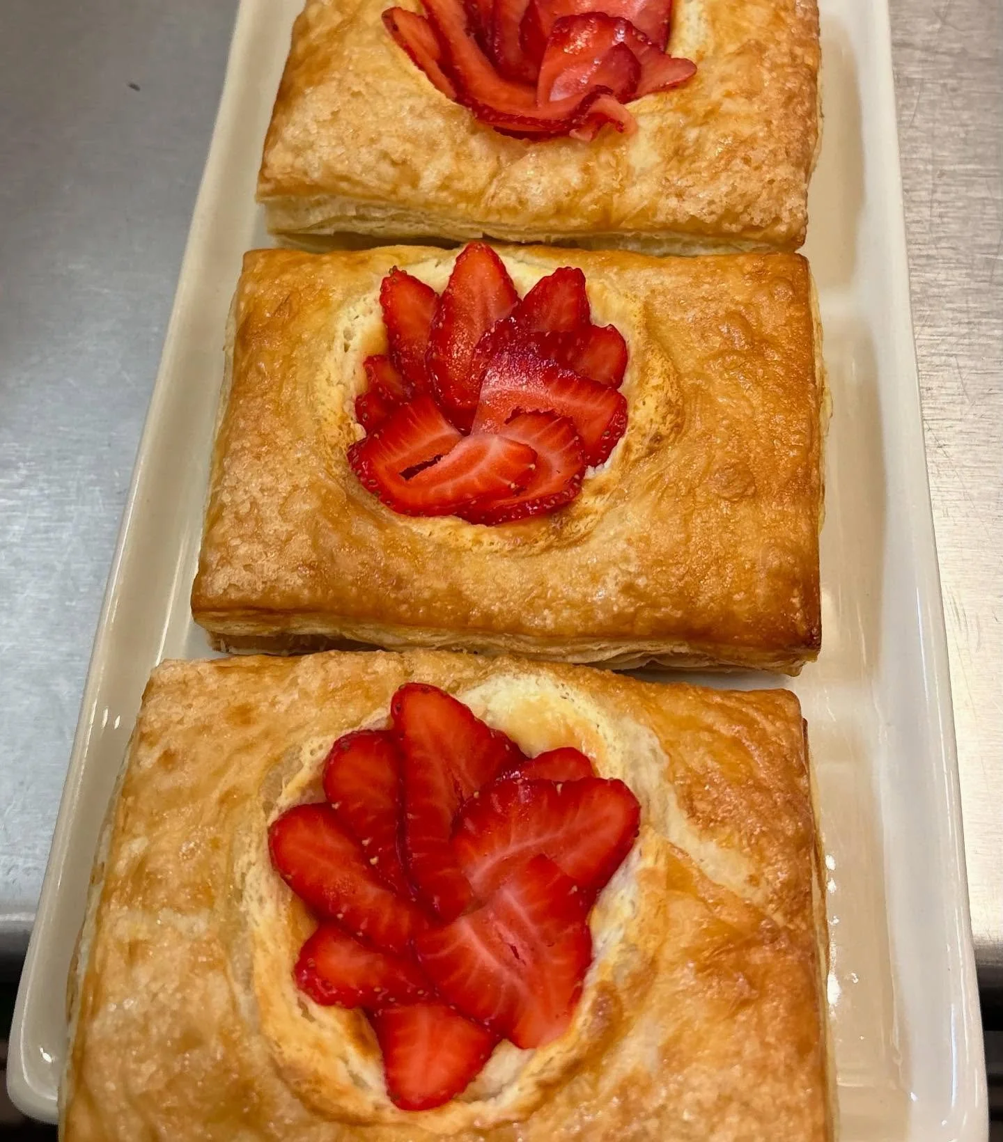 Start your day right at Carp Kitchen.
Our fresh-baked Cheese Danish with local strawberries is here&mdash;and it pairs perfectly with a cup of our rich, medium roasted Organic Sumatra coffee from Enne Caff&eacute;.

This single-origin brew is earthy,