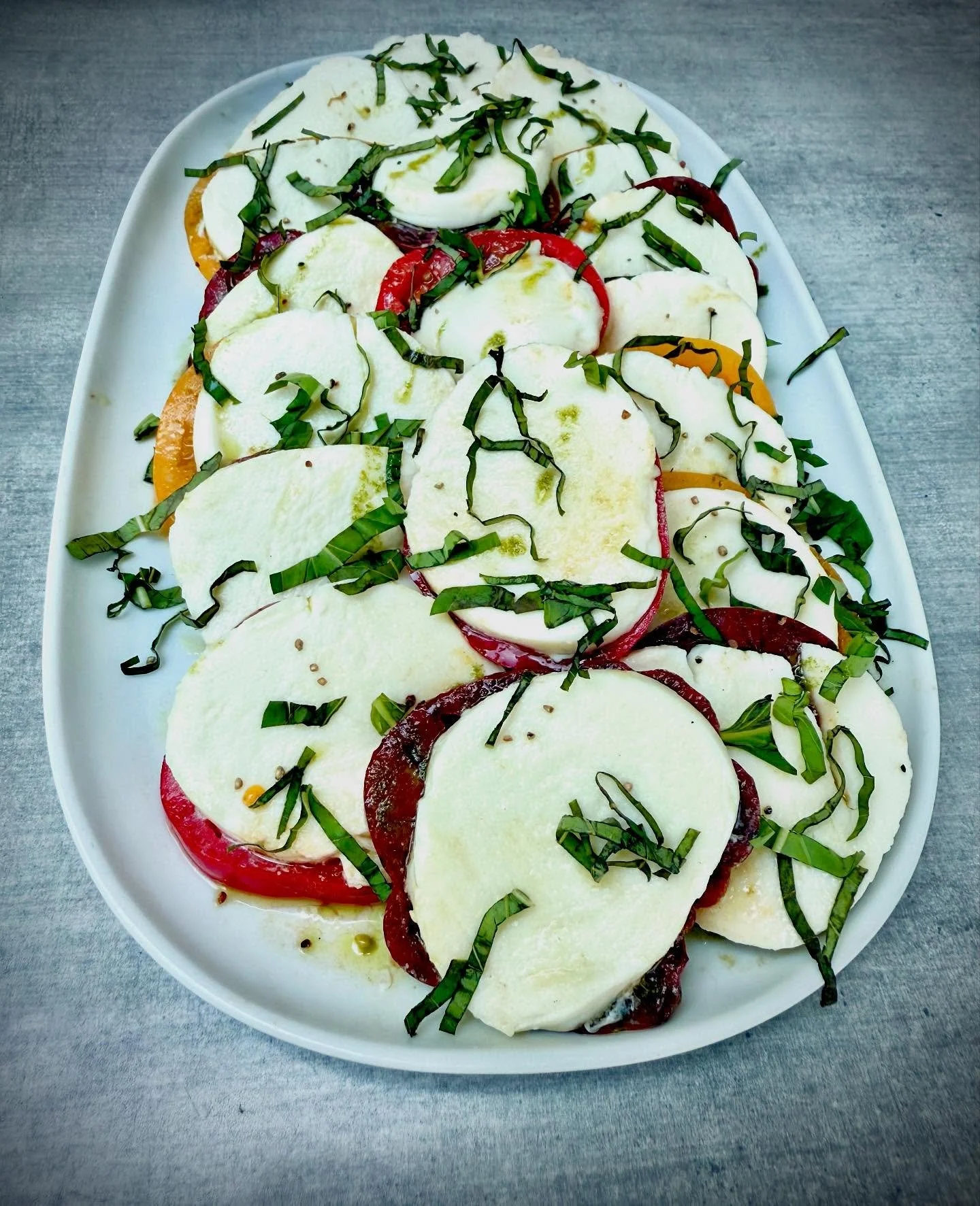 Summer on a plate. 🍅✨
Our Heirloom Tomato Caprese features peak-season tomatoes from Tutti Frutti Farms, creamy fresh mozzarella, hand-torn basil, olive oil, sea salt&mdash;and nothing else.

It&rsquo;s simple, stunning, and only here while these to